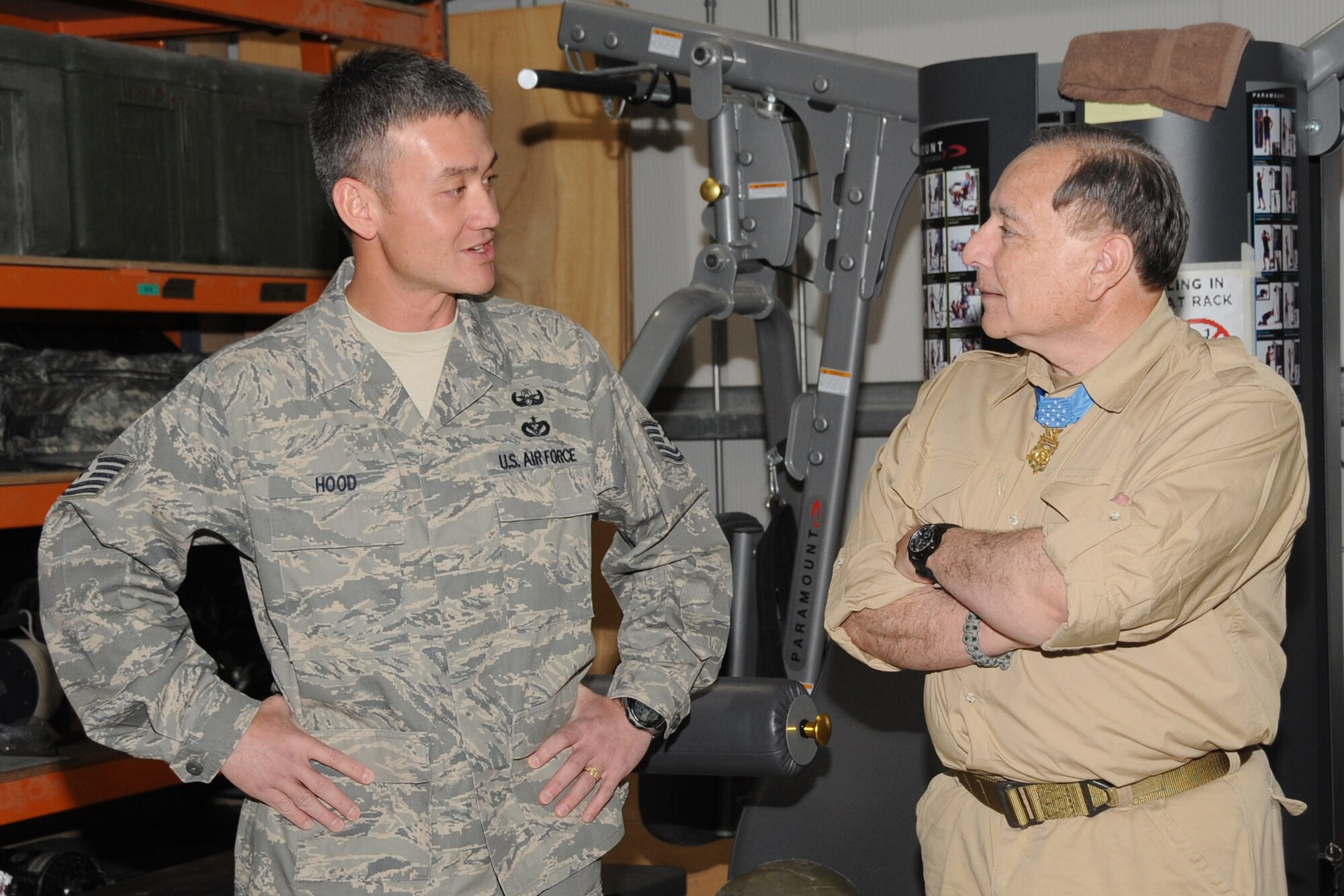 Retired Army Lt. Col. Alfred V. Rascon, Medal of Honor recipient, speaks with Tech. Sgt. Robert Hood, 380th Civil Engineer Squadron, explossive oridence disposal shop at an undisclosed location in Southwest Asia on April 12, 2010. Colonel Rascon earned the Medal of Honor for actions for taken on March 16, 1966, in the Republic of Vietnam. Then a specialist fourth class, his "extraordinary valor in he face of deadly enemy fire, his heroism in rescuing the wounded, and his gallantry by repeatedly risking his own life for his fellow soldiers are in keeping with the highest traditions of military service." Colonel Rascon and another Medal of Honor winner, retired Army Staff Sgt. Don J. Jenkins, visited the 380th AEW as part of tour by Armed Forces Entertainment. (U.S. Air Force Photo/Senior Airman Jenifer H. Calhoun/Released)
