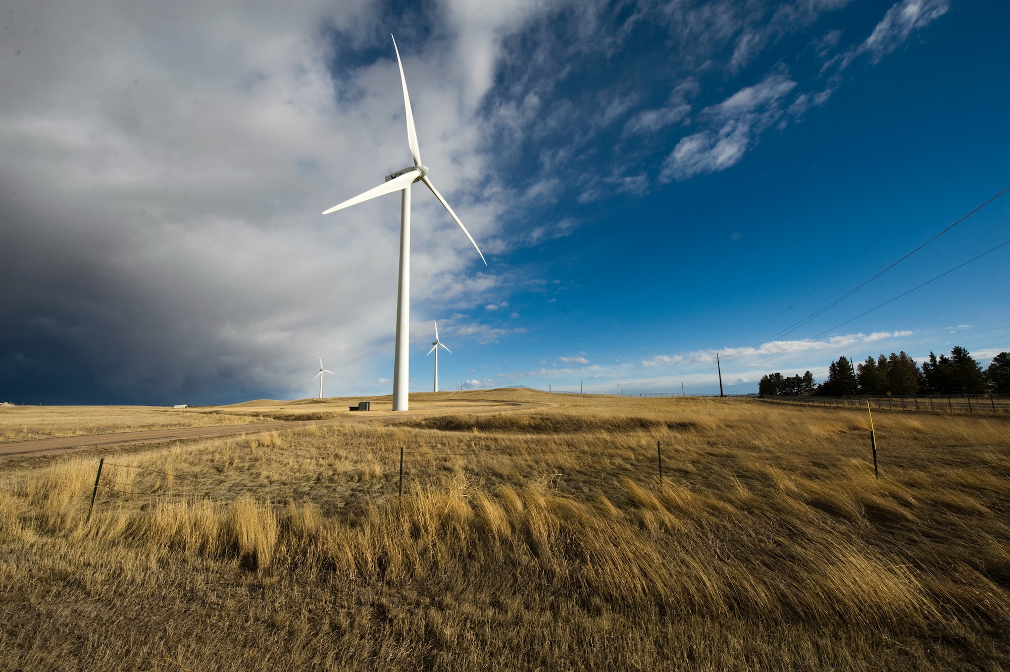 The biggest and newest of three wind turbines at F.E. Warren Air Force Base, Wyoming faces the wind coming across the high plains and push against the clouds that later dropped a few inches of snow on the base and surrounding city of Cheyenne on April 6, 2010. The larger wind turbine was completed and online early in 2009 and is rated at 2 mega watts of electrical energy that goes directly into the base power grid.  The other two produces a combined output of 1.3MW.  From most points on the base the wind turbines can be seen.  At its base the blades make a low whoosh sound. (U.S. Air Force photo/Lance Cheung)