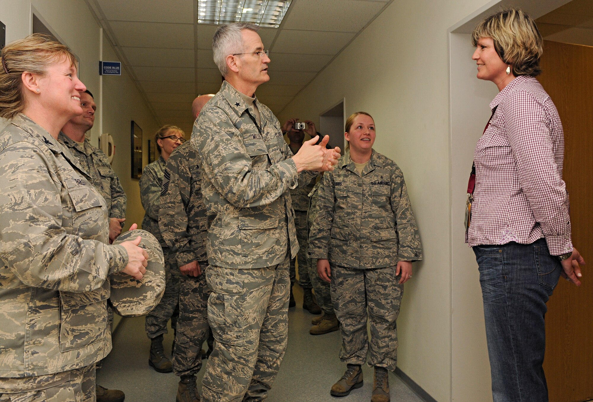 SPANGDAHLEM AIR BASE, Germany – Brig. Gen. Michael Miller, assistant surgeon general of Strategic Medical Plans, Programs and Budget, and Chief of the Medical Service Corps at the Office of the Surgeon General, speaks with Michaela Gutbier, 52nd Medical Operations Squadron public health administrator, commending her efforts for an Air Force Smart Operations for the 21st Century initiative that streamlined the public health assessment process April 13. General Miller visited Spangdahlem during his tour of U.S. Air Forces in Europe medical facilities. (U.S. Air Force photo/Senior Airman Benjamin Wilson)