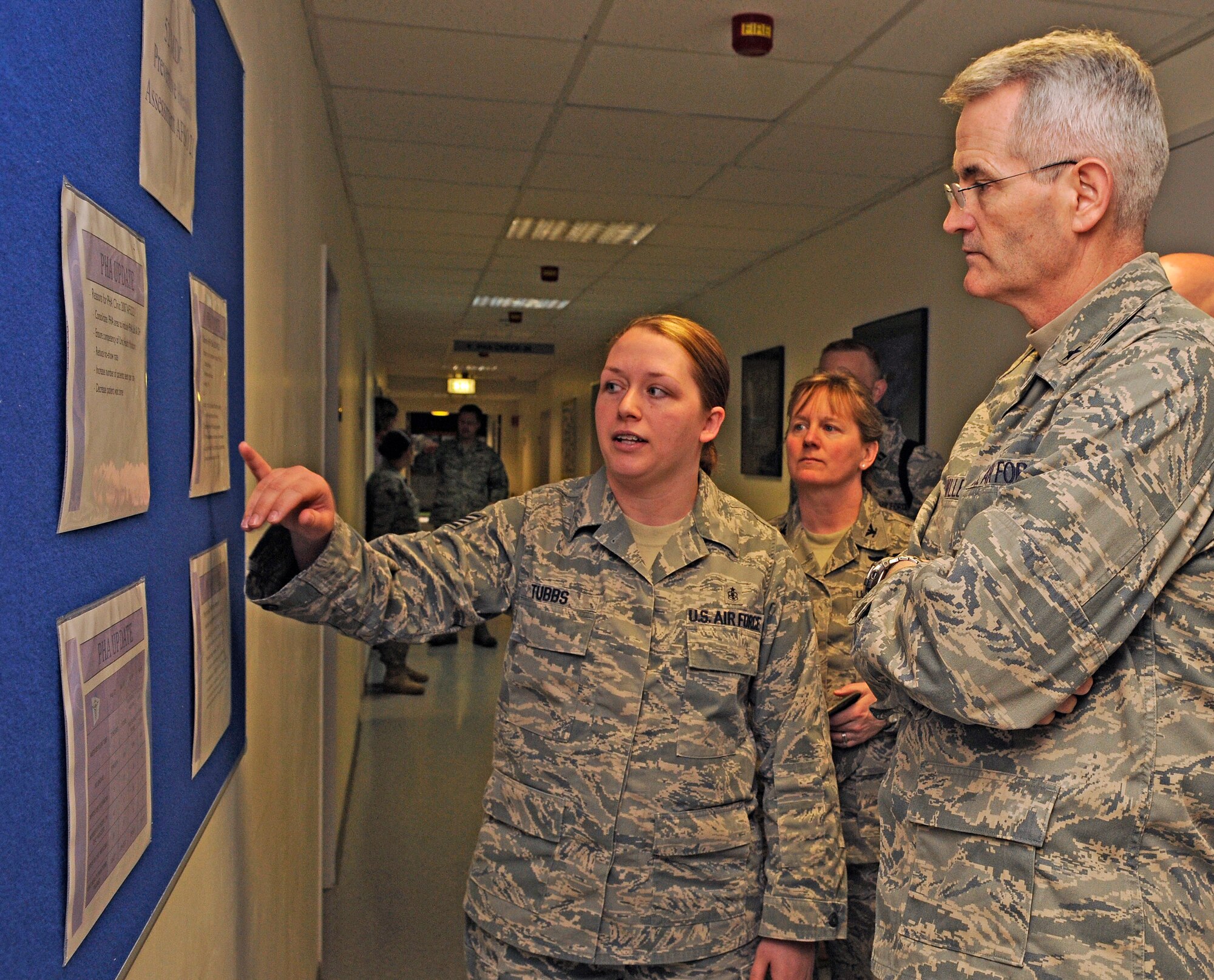 SPANGDAHLEM AIR BASE, Germany – Staff Sgt. Tonya Tubbs, 52nd Medical Operations Squadron aerospace medical technician, explains the procedures of Spangdahlem’s public health assessment to Brig. Gen. Michael Miller, assistant surgeon general of Strategic Medical Plans, Programs and Budget, and Chief of the Medical Service Corps at the Office of the Surgeon General, April 13. General Miller visited Spangdahlem during his tour of U.S. Air Forces in Europe medical facilities. (U.S. Air Force photo/Senior Airman Benjamin Wilson)