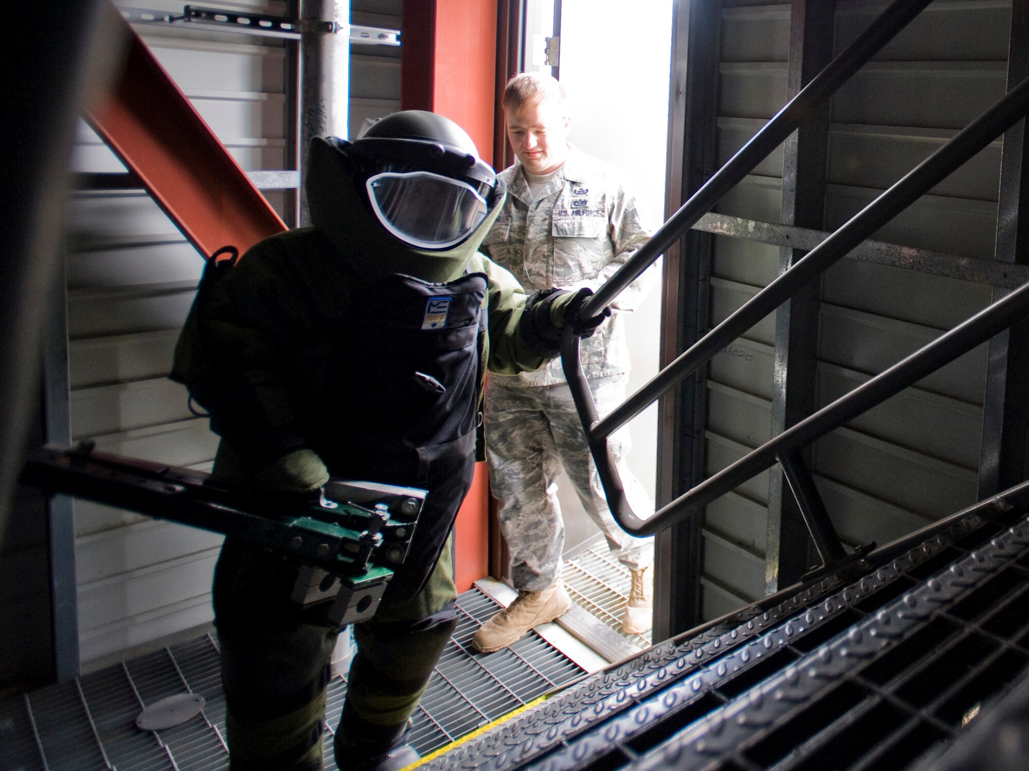 MISAWA AIR BASE, Japan -- Airman 1st Class Danee Hicks, 35th Civil Engineer Squadron explosive ordnance disposal apprentice, enters the Misawa Fire Emergency Services Training Center during a bomb-suit stress drill April 15. The timed drill simulates the stresses that occur when EOD members perform their duties while wearing the 70-pound bomb suit. (U.S. Air Force photo/Senior Airman Jamal D. Sutter)