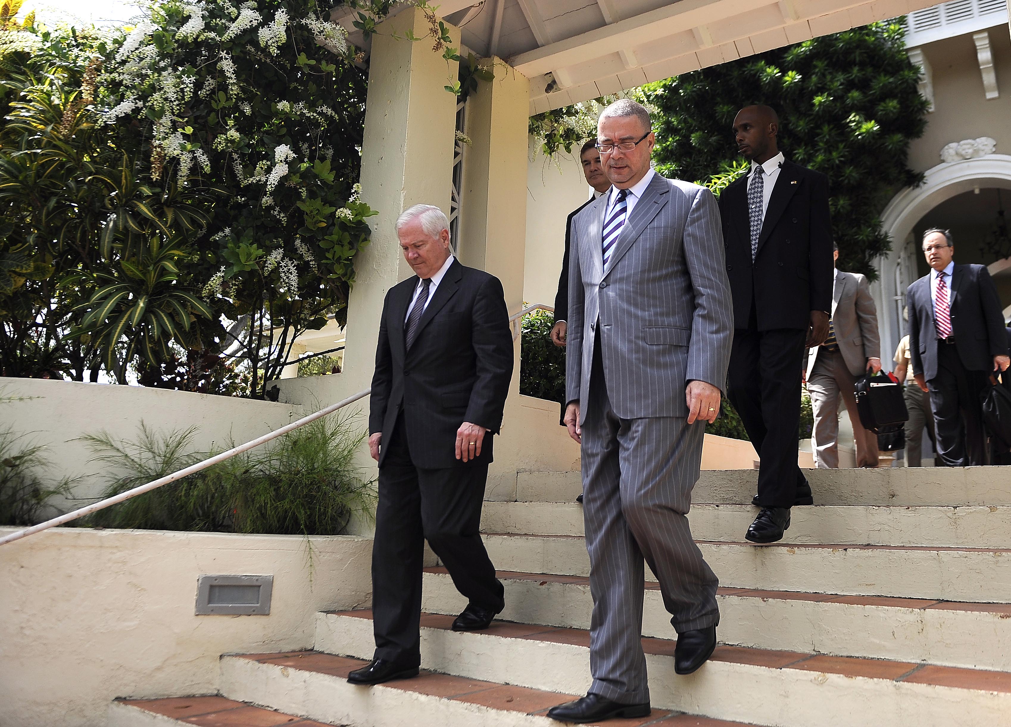 U.S. Defense Secretary Robert M. Gates, left, walks with the Prime