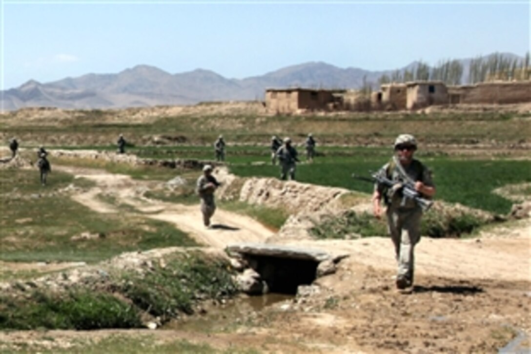 U.S. Army paratroopers travel back to combat outpost Kherwar after a mission they conducted in the village of Bakshikhala, Kherwar district, Logar province, Afghanistan, April 12, 2010. The paratroopers are assigned to Company C, 1st Squadron, 91st Infantry Regiment, 173rd Airborne Brigade Combat Team. The purpose of this mission was to provide a presence and provide medical care.