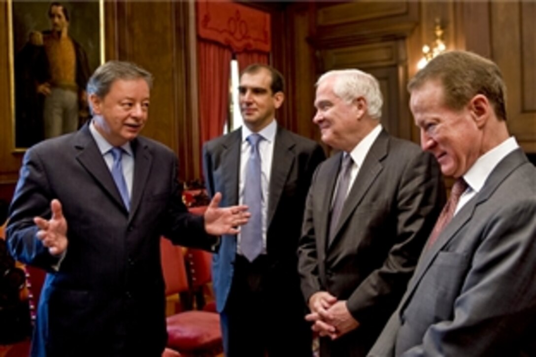 Colombian Defense Minister Gabriel Silva, U.S. Defense Secretary Robert M. Gates,
center right, and U.S. Ambassador to Colombia William R. Brownfield talk to one another at the Presidential Palace before meetiing with President Alvaro Uribe in Bogota, April 15, 2010.