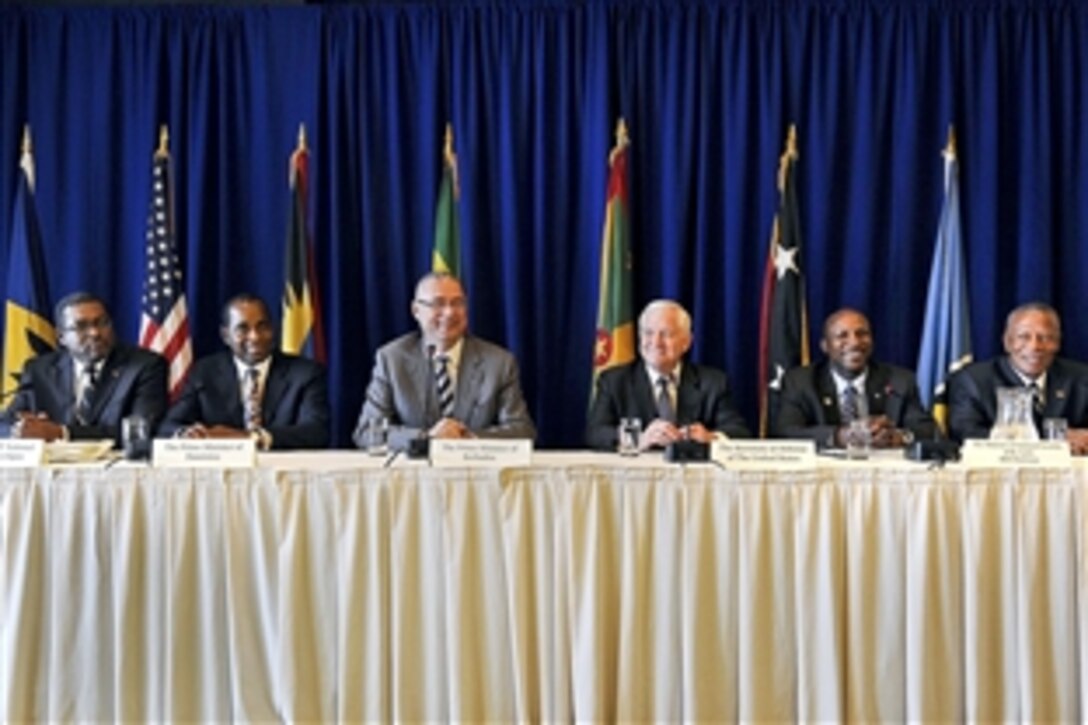 U.S. Defense Secretary Robert M. Gates, third from right, listens to the opening remarks of David Thompson, third from left, prime minister of Barbados, during a press conference in Bridgetown, Barbados, April 16, 2010. Gates met with the prime and defense ministers of St. Kitts, Antigua, Dominica, Barbados, St. Lucia, Grenada and St. Vincent to discuss regional security cooperation under the Caribbean Basin Security Initiative.