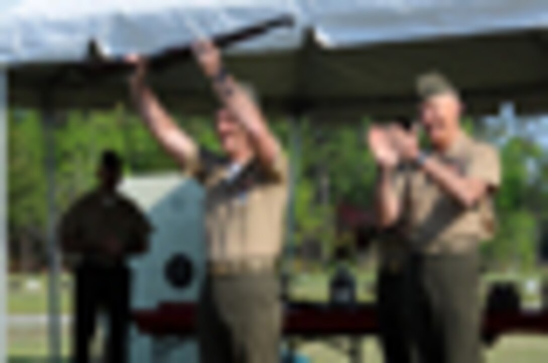 A corporal, which was the equivilent of to the rank of E-3, instructs a recruit in close combat techniques during the early 1940's. In that time, coaches were often made from newly graduated Marines who had been successful in marksmanship as recruits.