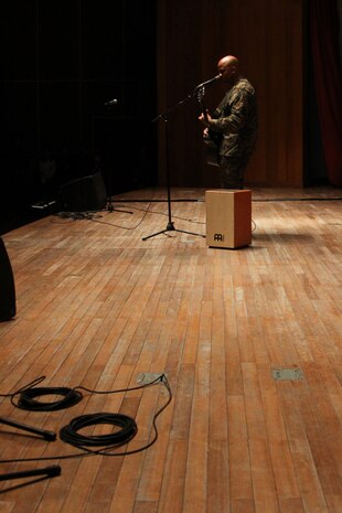 Yechon Air Base, REPUBLIC OF KOREA - Staff Sgt. Shane Hall performs a song on guitar during the Exercise Foal Eagle 2010 Korean - U.S. Friendship Event at the theater here April 16. Hall has a band that plays around the local area in Iwakuni, Japan.