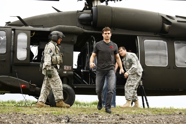 NASCAR driver Jeff Gordon disembarks from a UH-60 Black Hawk helicopter as he arrives at the Advanced Law Enforcement Rapid Response Training (ALERRT) facility to suit up with National Guard Special Forces Soldiers, in Texas, on April 15, 2010. (U.S. Air Force photo by Senior Master Sgt. Mike Arellano/Released)
