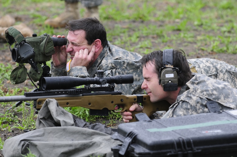 NASCAR driver Jeff Gordon takes aim with a sniper's rifle, with the help of a spotter, while suiting up with National Guard Security Forces Soldiers in Texas, on April 15, 2010. (U.S. Air Force photo by Senior Master Sgt. Mike Arellano/Released)