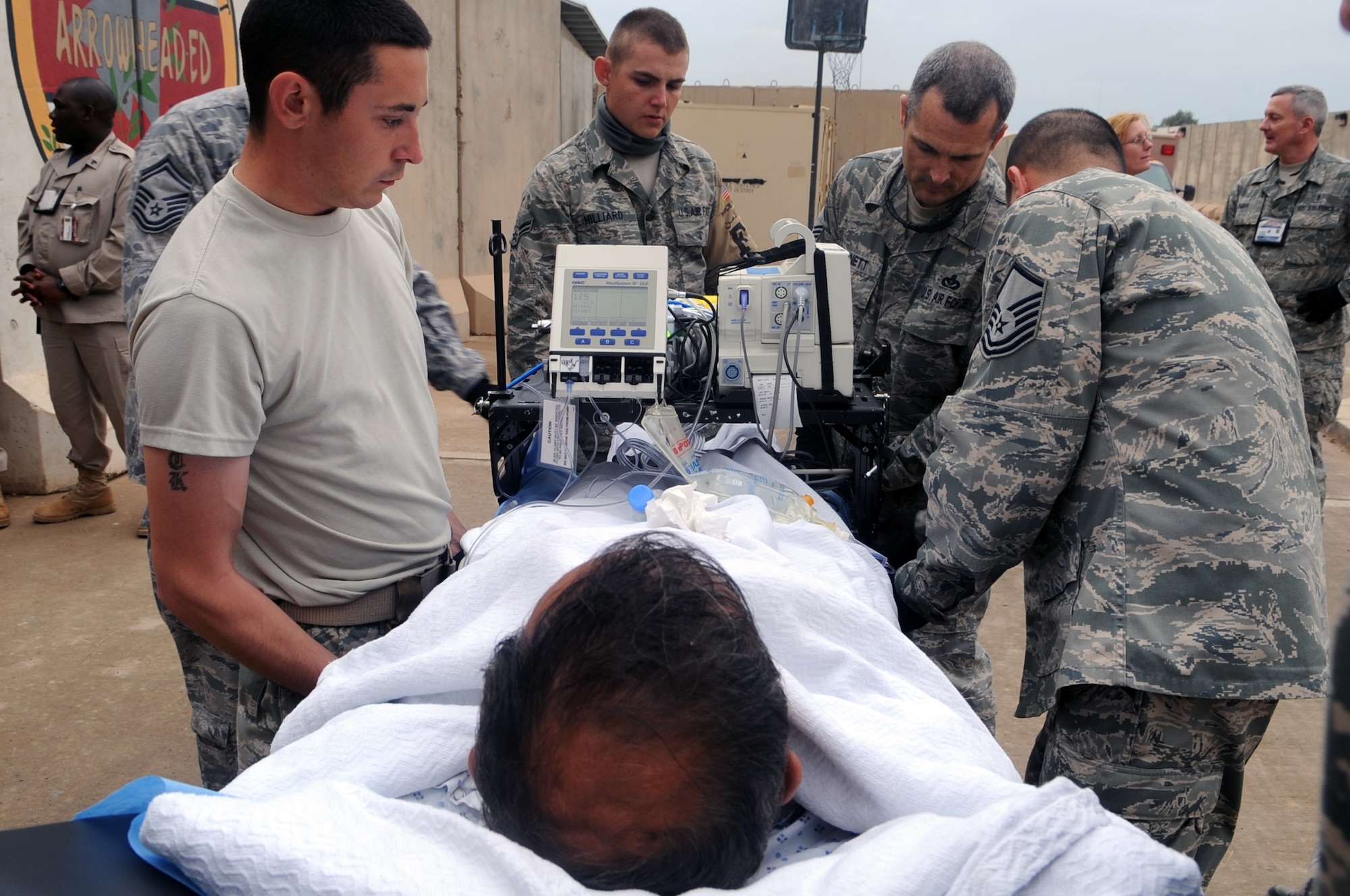 332nd Expeditionary Medical Group personnel secure a patient stretcher during an aeromedical evacuation mission at Joint Base Balad, Iraq, April 17, 2010. The 332nd EMDG is expecting about five aeromedical evacuation missions a week from Afghanistan, plus select in-system flights that will be flown as needed. (U.S. Air Force photo/Senior Airman Brittany Y. Bateman/Released)