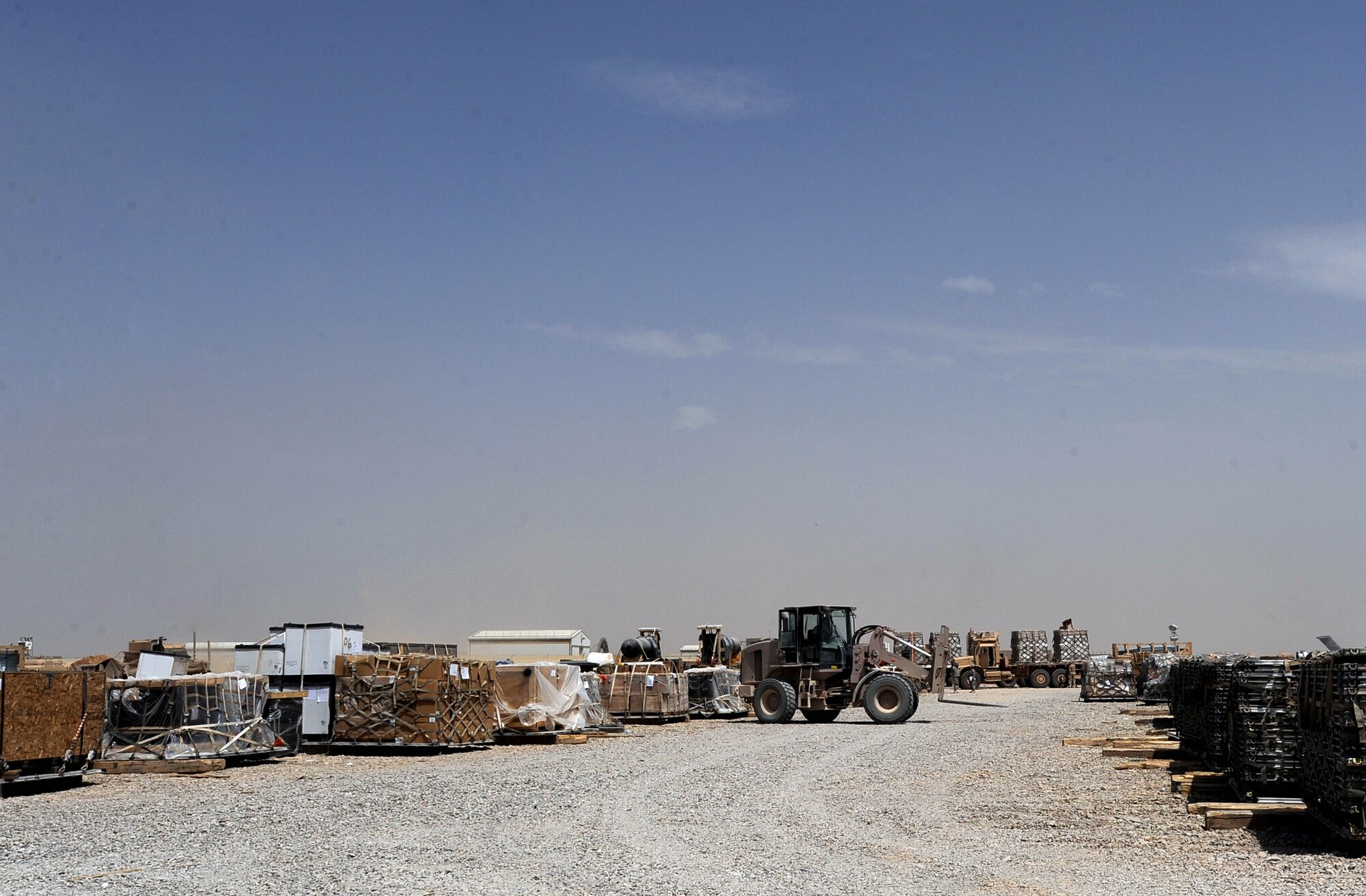 An Aerial porter assigned to the 451st Expeditionary Logistics Readiness Squadron Detachment 1, places downloaded cargo pallets in a cargo yard utilizing a 10,000-pound All-Terrain Forklift, April 15, 2010, at Camp Bastion, Afghanistan. The unit's air-traffic operations center and ramp operations have uploaded and downloaded more than 40,000 short-tons of cargo from almost 3,000 aircraft moving through the airfield here since January 1. Moving cargo off airframes such as C-17 Globemaster IIIs, C-130 Hercules, Russian IL-76s and DC-8s, aerial-port Airmen ensure Coalition Forces get the equipment and supplies they need.(U.S. Air Force photo/Staff Sgt. M. Julian Martinez/released)