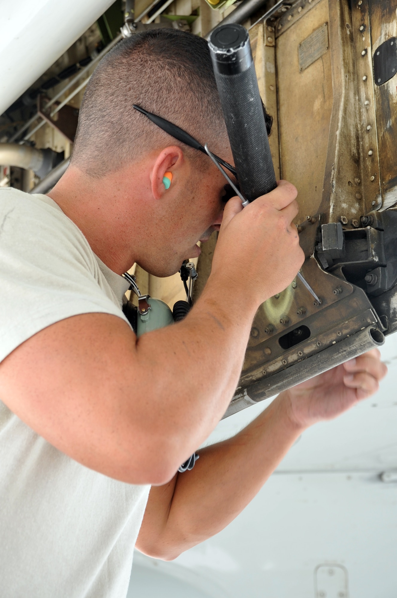 Staff Sgt.Eric Crotsley, an E-3 Sentry Airborne Warning and Control System aircraft maintenance Airman deployed with the 380th Expeditionary Aircraft Maintenance Squadron's Sentry aircraft maintenance unit, works on an E-3 on the flightline at a non-disclosed base in Southwest Asia on April 16, 2010. He is deployed from the 552nd Aircraft Maintenance Squadron at Tinker Air Force Base, Okla., and his hometown is Abilene, Texas. (U.S. Air Force Photo/Master Sgt. Scott T. Sturkol/Released)