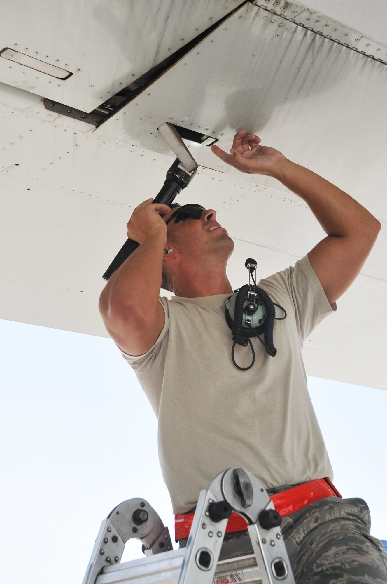 Staff Sgt.Eric Crotsley, an E-3 Sentry Airborne Warning and Control System aircraft maintenance Airman deployed with the 380th Expeditionary Aircraft Maintenance Squadron's Sentry aircraft maintenance unit, works on an E-3 on the flightline at a non-disclosed base in Southwest Asia on April 16, 2010. He is deployed from the 552nd Aircraft Maintenance Squadron at Tinker Air Force Base, Okla., and his hometown is Abilene, Texas. (U.S. Air Force Photo/Master Sgt. Scott T. Sturkol/Released)