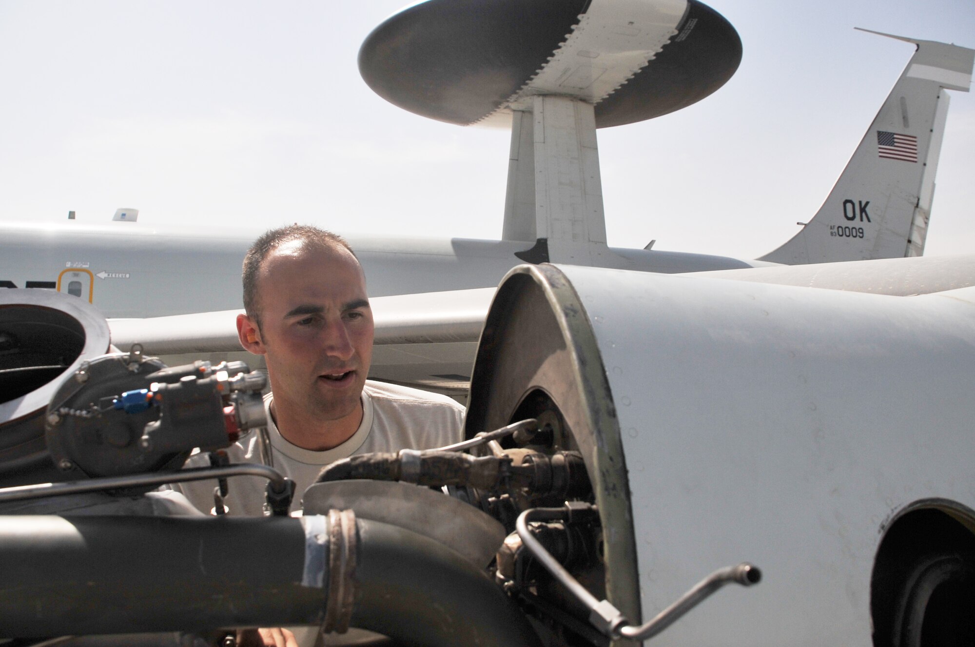 Staff Sgt. Kurt Weisel, an E-3 Sentry Airborne Warning and Control System aircraft electrical and environmental systems craftsman deployed with the 380th Expeditionary Aircraft Maintenance Squadron's Sentry aircraft maintenance unit, works on an E-3 on the flightline at a non-disclosed base in Southwest Asia on April 16, 2010. He is deployed from the 552nd Aircraft Maintenance Squadron at Tinker Air Force Base, Okla., and his hometown is Crown Point, Ind. (U.S. Air Force Photo/Master Sgt. Scott T. Sturkol/Released)