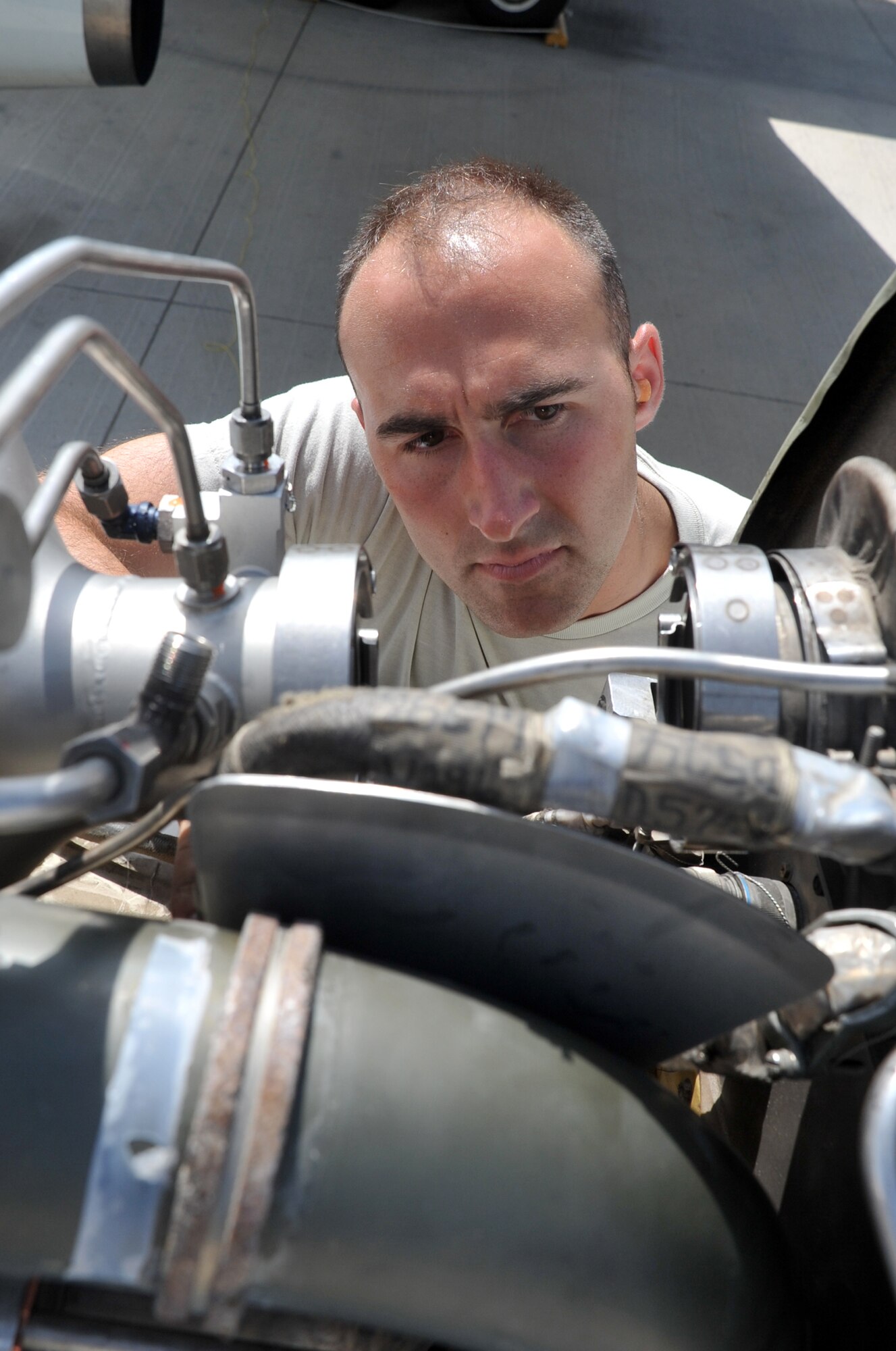 Staff Sgt. Kurt Weisel, an E-3 Sentry Airborne Warning and Control System aircraft electrical and environmental systems craftsman deployed with the 380th Expeditionary Aircraft Maintenance Squadron's Sentry aircraft maintenance unit, works on an E-3 on the flightline at a non-disclosed base in Southwest Asia on April 16, 2010. He is deployed from the 552nd Aircraft Maintenance Squadron at Tinker Air Force Base, Okla., and his hometown is Crown Point, Ind. (U.S. Air Force Photo/Master Sgt. Scott T. Sturkol/Released)