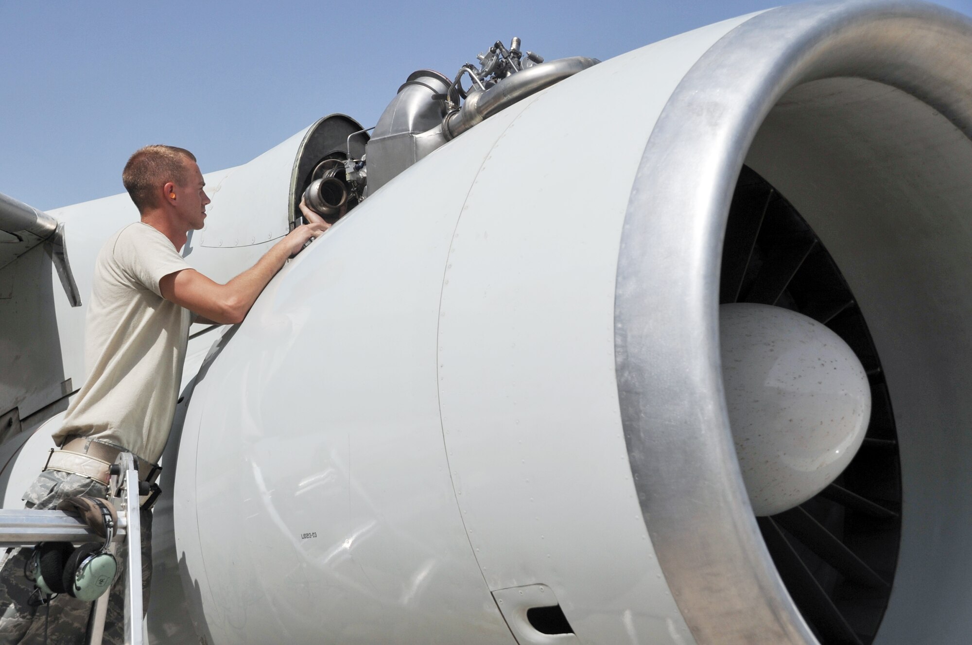 Senior Airman Daniel Shoemaker, an E-3 Sentry Airborne Warning and Control System aircraft electrical and environmental systems journeyman deployed with the 380th Expeditionary Aircraft Maintenance Squadron's Sentry aircraft maintenance unit, works on an E-3 on the flightline at a non-disclosed base in Southwest Asia on April 16, 2010. He is deployed from the 552nd Aircraft Maintenance Squadron at Tinker Air Force Base, Okla., and his hometown is Waxahachie, Texas. (U.S. Air Force Photo/Master Sgt. Scott T. Sturkol/Released)