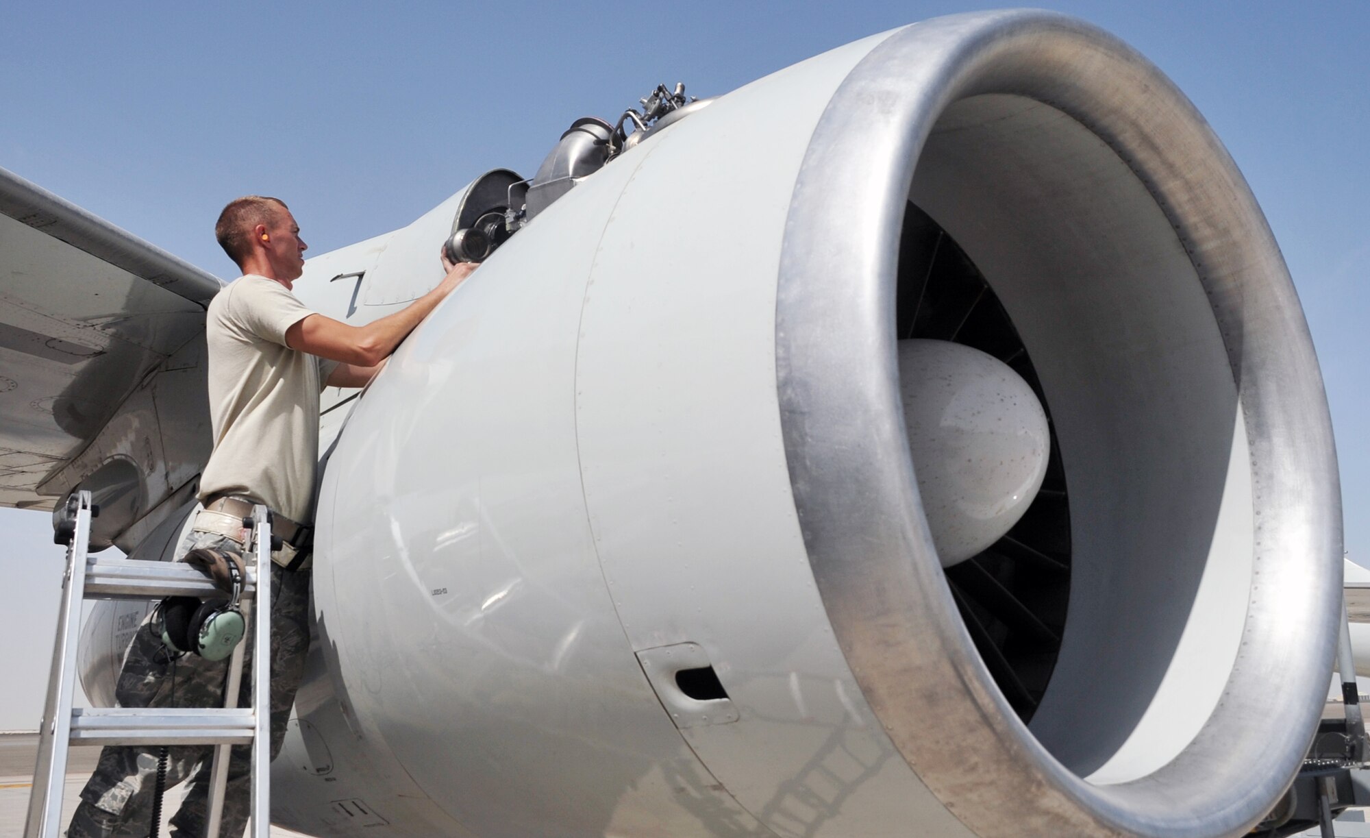 Senior Airman Daniel Shoemaker, an E-3 Sentry Airborne Warning and Control System aircraft electrical and environmental systems journeyman deployed with the 380th Expeditionary Aircraft Maintenance Squadron's Sentry aircraft maintenance unit, works on an E-3 on the flightline at a non-disclosed base in Southwest Asia on April 16, 2010. He is deployed from the 552nd Aircraft Maintenance Squadron at Tinker Air Force Base, Okla., and his hometown is Waxahachie, Texas. (U.S. Air Force Photo/Master Sgt. Scott T. Sturkol/Released)