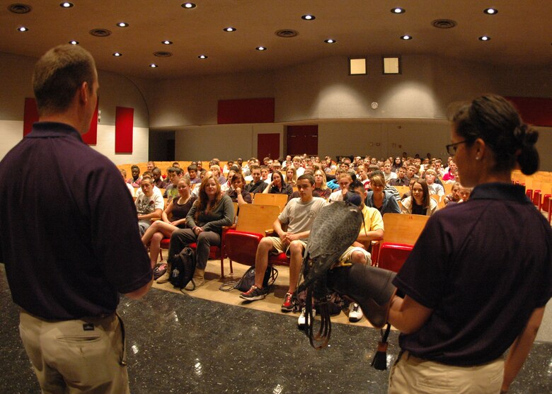 Two U.S. Air Force Academy cadet falconers introduce their school’s peregrine falcon mascot, Havoc, to students at Crestview High School near Eglin Air Force Base, Fla., April 9.  The visiting cadets spoke to students about their unique extracurricular duties as falconers and how to pursue an Air Force commission through the prestigious military academy in Colorado Springs, Colo.  (U.S. Air Force photo/Dan Neely)