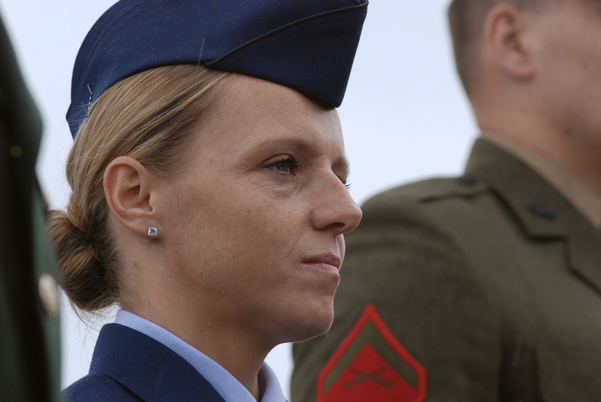 CAMP MABRY, Texas -- Under somber rainy skies, in front of a replica Vietnam Memorial Wall, 13 service members took the Oath of Allegiance to become American citizens
Among the new Americans was Senior Airman Ivanna Leininger-Riedlova, 74th Aerial Port Squadron, Lackland Air Force Base, Texas, who left behind her Czech citizenship
U.S. District Judge Lee Yeakel gave the Oath of Allegiance during the small ceremony, which was part of the weekend-long American Heroes Air Show here.
Airman Leininger-Riedlova said her husband, who is an Army medic, encouraged her to join the Air Force. "I was 32 when I enlisted in May '08 here in San Antonio," she said.
While she acknowledged it was difficult to leave the Czech Republic and never thought she would be an American citizen, she is glad she did. "I have goals," she said. "I want to be a linguist." Airman Leininger-Riedlova said, "I just wanted to be part of fighting for freedom." (U.S. Air Force photo/Airman 1st Class Brian McGloin)
