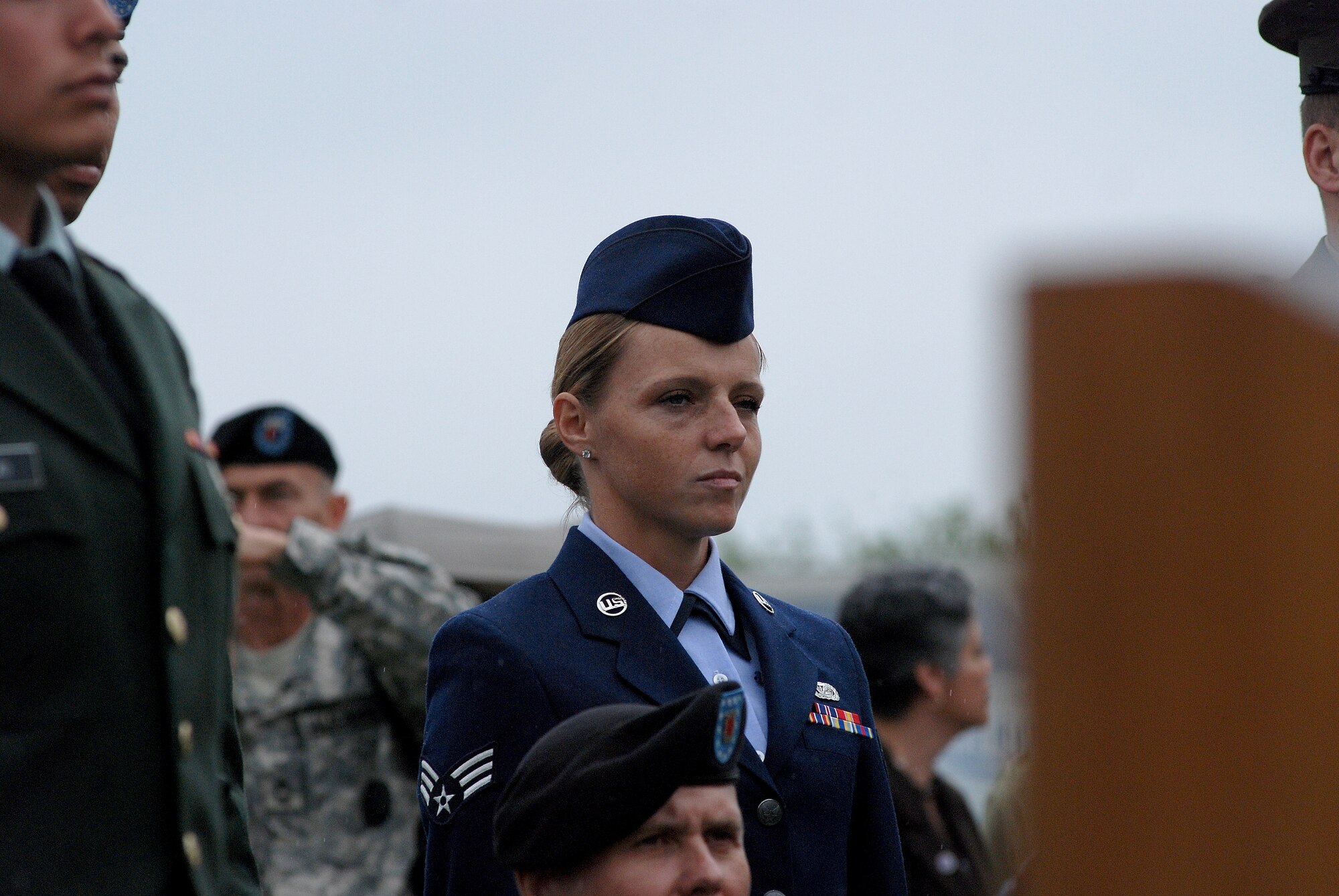 CAMP MABRY, Texas -- Under somber rainy skies, in front of a replica Vietnam Memorial Wall, 13 service members took the Oath of Allegiance to become American citizens
Among the new Americans was Senior Airman Ivanna Leininger-Riedlova, 74th Aerial Port Squadron, Lackland Air Force Base, Texas, who left behind her Czech citizenship
U.S. District Judge Lee Yeakel gave the Oath of Allegiance during the small ceremony, which was part of the weekend-long American Heroes Air Show here.
Airman Leininger-Riedlova said her husband, who is an Army medic, encouraged her to join the Air Force. "I was 32 when I enlisted in May '08 here in San Antonio," she said.
While she acknowledged it was difficult to leave the Czech Republic and never thought she would be an American citizen, she is glad she did. "I have goals," she said. "I want to be a linguist." Airman Leininger-Riedlova said, "I just wanted to be part of fighting for freedom." (U.S. Air Force photo/Airman 1st Class Brian McGloin)

