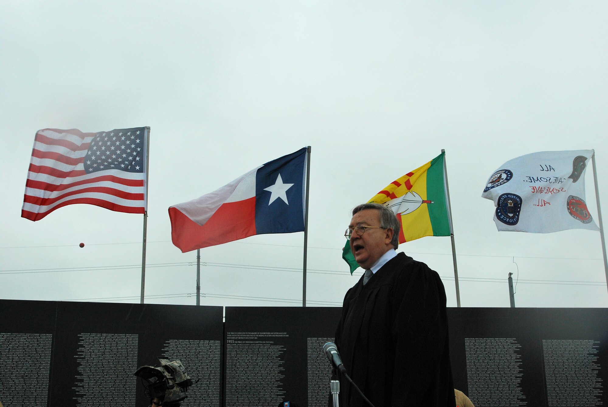 CAMP MABRY, Texas -- Under somber rainy skies, in front of a replica Vietnam Memorial Wall, 13 service members took the Oath of Allegiance to become American citizens
Among the new Americans was Senior Airman Ivanna Leininger-Riedlova, 74th Aerial Port Squadron, Lackland Air Force Base, Texas, who left behind her Czech citizenship
U.S. District Judge Lee Yeakel gave the Oath of Allegiance during the small ceremony, which was part of the weekend-long American Heroes Air Show here.
Airman Leininger-Riedlova said her husband, who is an Army medic, encouraged her to join the Air Force. "I was 32 when I enlisted in May '08 here in San Antonio," she said.
While she acknowledged it was difficult to leave the Czech Republic and never thought she would be an American citizen, she is glad she did. "I have goals," she said. "I want to be a linguist." Airman Leininger-Riedlova said, "I just wanted to be part of fighting for freedom." (U.S. Air Force photo/Airman 1st Class Brian McGloin)
