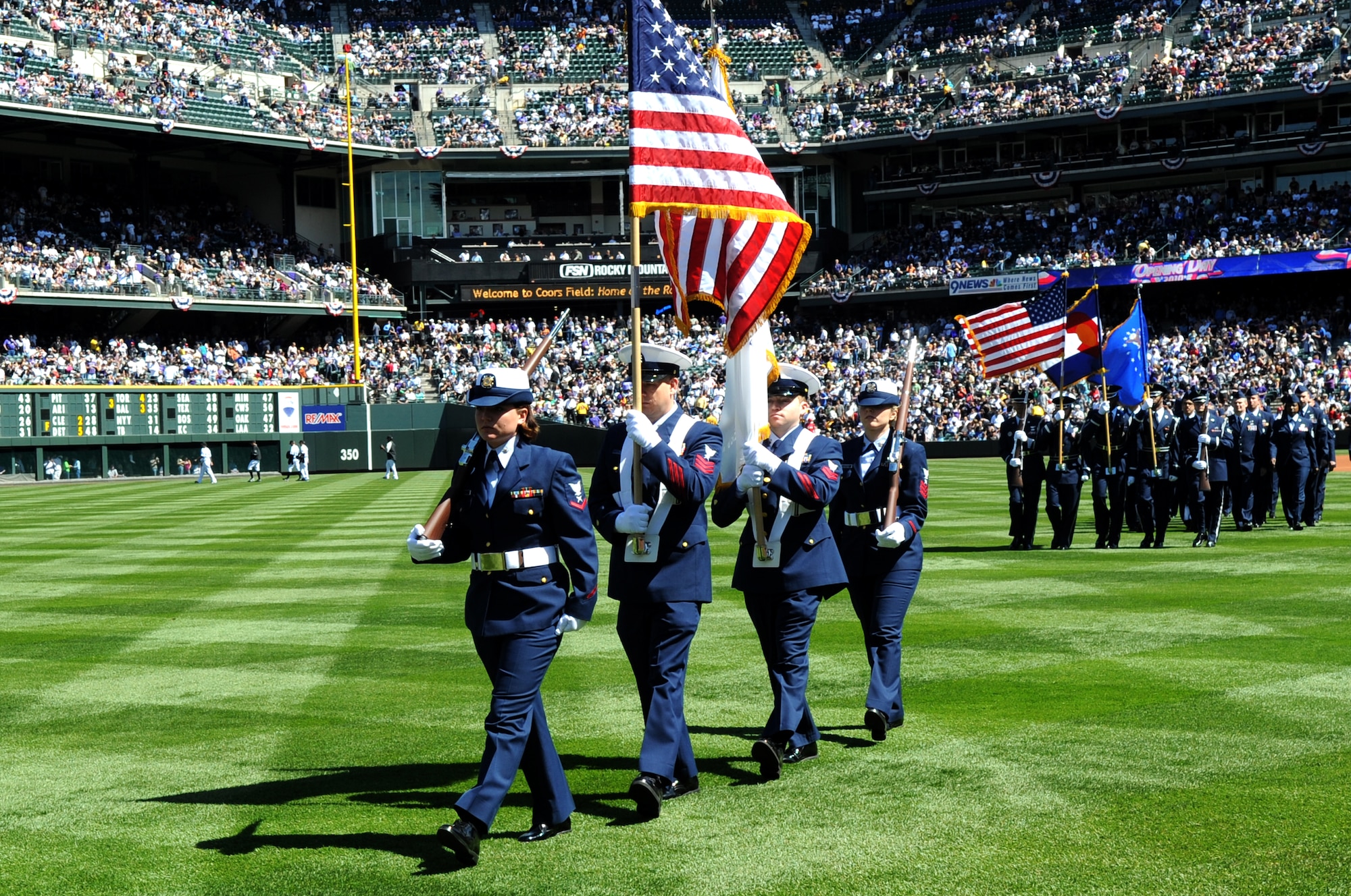 DENVER, Colo. -- Coast Guardsmen from Colorado recruiting stations and Buckley Air Force Base perform for a crowd of 45,509 people during Colorado Rockies Opening Day April 9 at Coors Field. (U.S. Air Force photo by Airman 1st Class Marcy Glass)