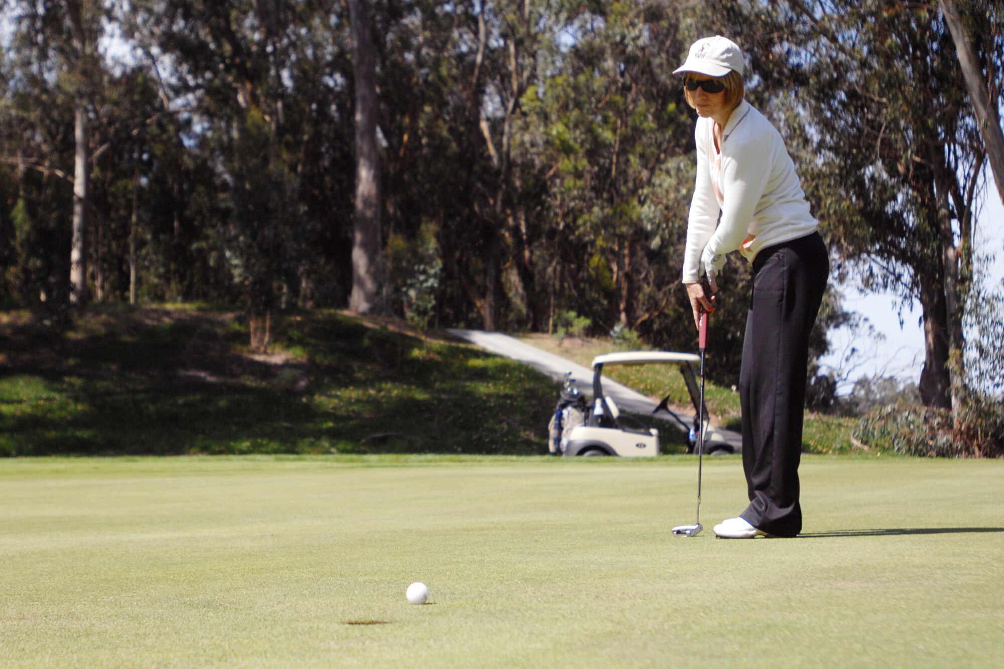 VANDENBERG AIR FORCE BASE, Calif. – Karen Long, putts the ball toward the hole during the Spring Open Golf Tournament at Marshallia Ranch Golf Course here Sunday, April 18, 2010. The Spring Open is a stroke-play tournament which is where the winner is the person with the lowest score. (U.S. Air Force photo/Senior Airman Christopher Hubenthal)
