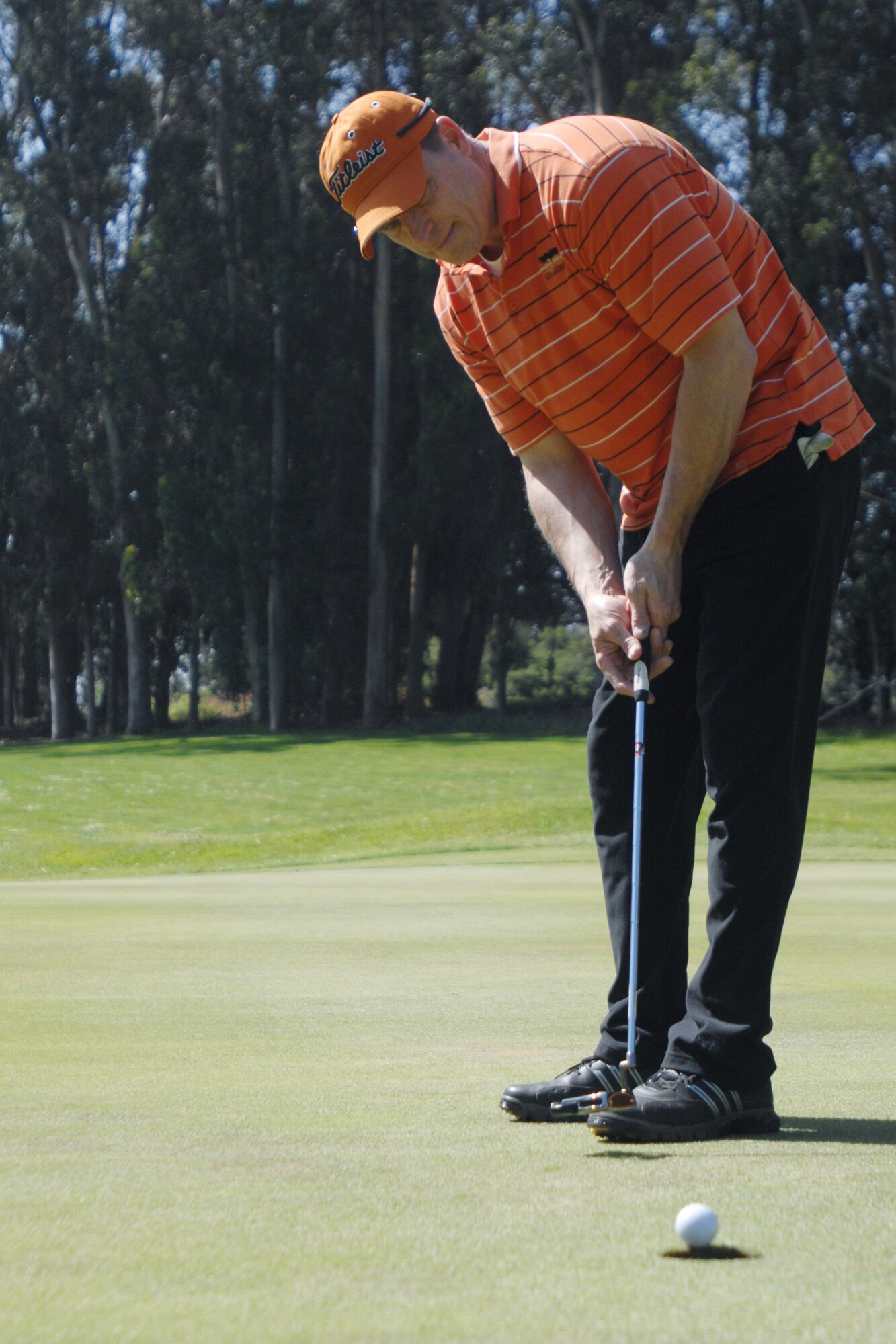 VANDENBERG AIR FORCE BASE, Calif. – Putting the ball, Daryl Parker, follows through with his shot during the Spring Open Golf Tournament at Marshallia Ranch Golf Course here Sunday, April 18, 2010. The Spring Open is a two day tournament consisting of 36 holes. (U.S. Air Force photo/Senior Airman Christopher Hubenthal)