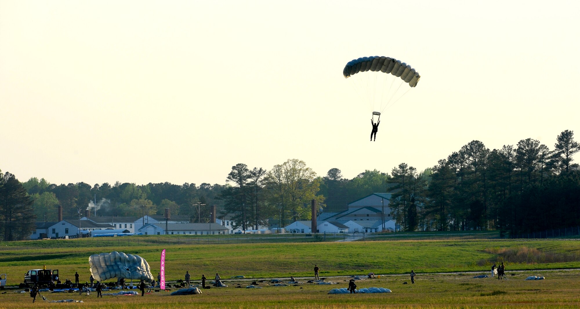 A Navy SEAL drifts to the ground after jumping from a C-17 Globemaster III over Fort Picket Maneuver Training Center, Va., April 15.  The jump was part of joint training exercise with the 517th Airlift Squadron from Elmendorf Air Force Base, Alaska. The training consisted of high altitude, high opening and high altitude, low opening jumps between 5,000 and 12,500 feet. (Air Force photo by Staff Sgt. Brian Ferguson)