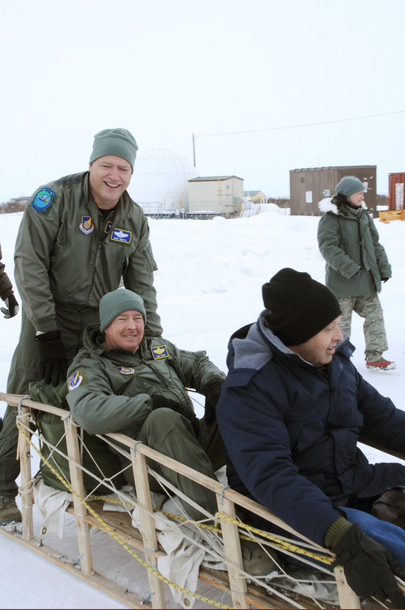 Gen. Gary North, Lt. Gen. Dana Atkins and Robert Smiley prepare for a snow-machine ride from the airport to the local clinic April 17, 2010, in Selawik, Alaska. General North is the Pacific Air Forces commander, General Atkins is the Alaskan Command commander and Mr. Smiley is the Office of Secretary of Defense acting Reserve Affairs deputy assistant secretary. (U.S. Air Force photo/Tech. Sgt. Melissa E. Chatham)