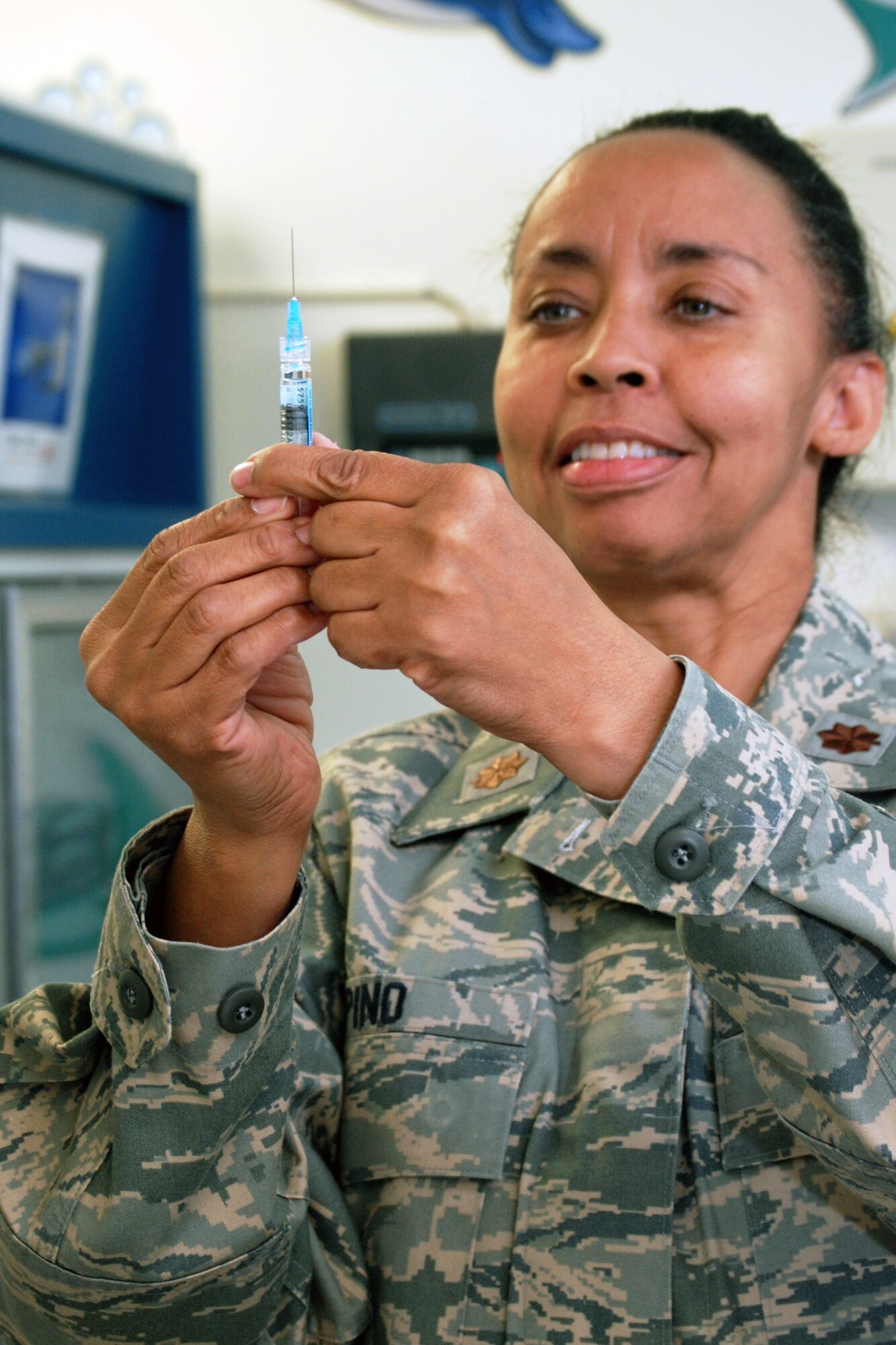 Maj. Paula Pino prepares to administer a flu shot during the unit's training March 6, 2010, at Patrick Air Force Base, Fla. Major Pino is assigned to the 920th Aeromedical Staging Squadron. (U.S. Air Force Photo/Tech. Sgt. Heather Kelly)