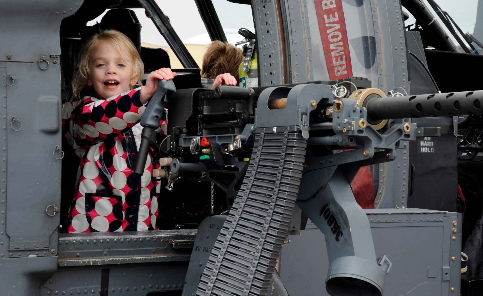 Madilyn Henderson sits in a HH-60 Pave Hawk static display April 17 during Cannon's first open house since it's change over from a Fighter Wing to the 27th Special Operations Wing. The open house features the 27 SOW and Air Force Special Operations Command personnel, units and assets at Cannon Air Force Base, N.M., and other special operations units . (U.S. Air Force photo by Senior Airman Evelyn Chavez)
    