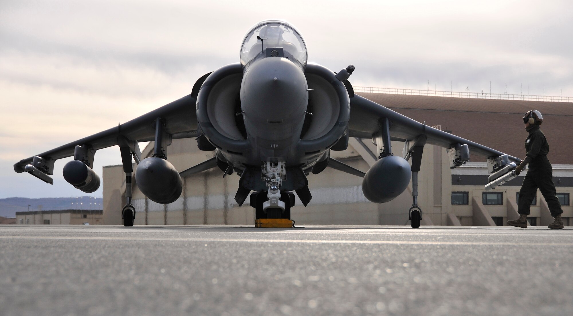 U.S. Marine Lance Cpl. Rachelle Carl performs preflight inspections on an AV-8B Harrier during RED FLAG-Alaska 10-2, April 19, 2010, Eielson Air Force Base, Alaska. RF-A is a Pacific Air Forces-directed field training exercise for United States and coalition forces under simulated combat conditions. Lance Corporal Carl is assigned to VMA-211, Marine Corps Air Station, Yuma, AZ. (U.S. Air Force photo/Staff Sgt. Christopher Boitz)