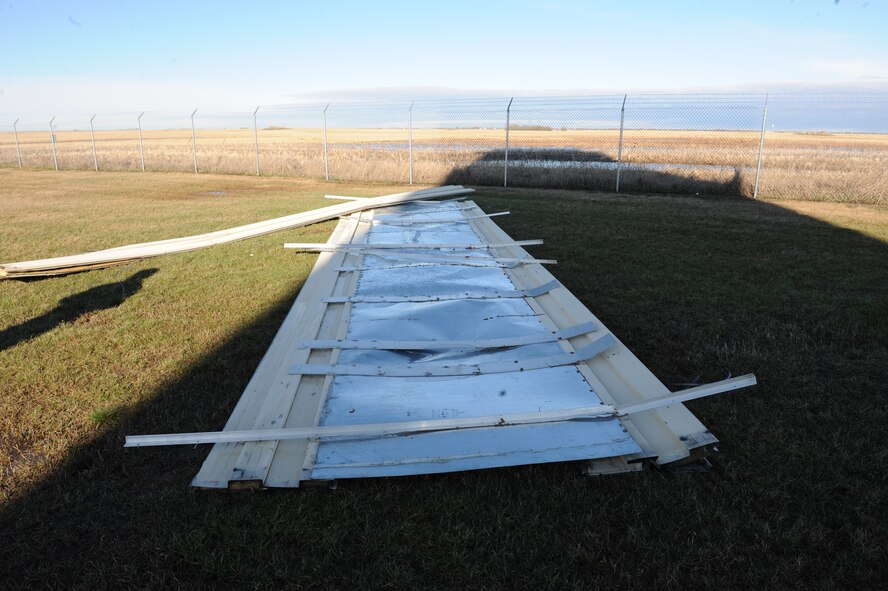 MINOT AIR FORCE BASE, N.D. -- The air traffic control tower at Minot Air Force Base was damaged by high winds April 14. The wind caused an estimated $20,000 in damage and required urgent repairs to protect electronic equipment inside.  Base operations were not affected. (U.S. Air Force photo by Staff Sgt. Keith Ballard)
