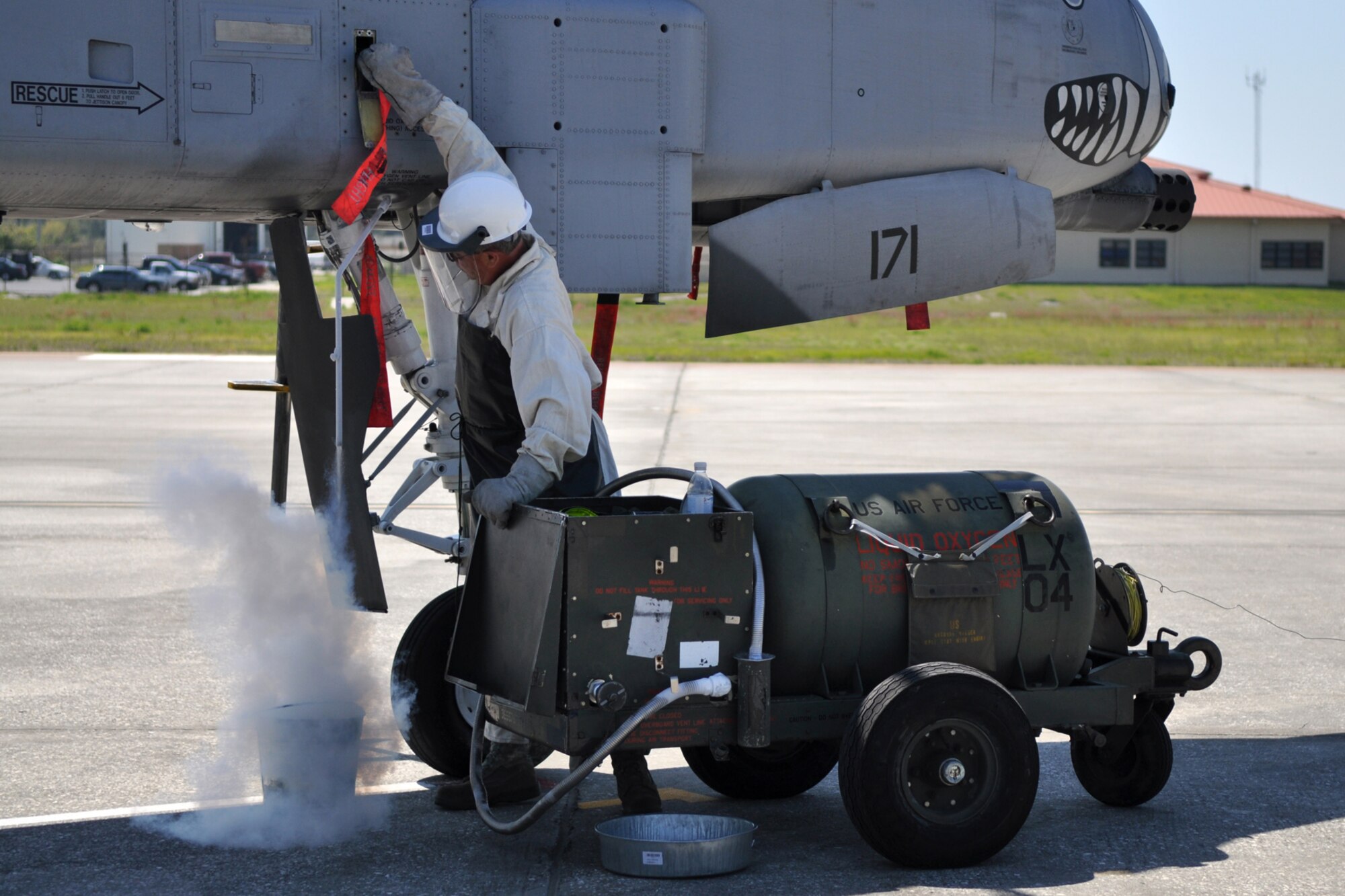 Tech. Sgt. Michael Zeigler, crew chief, 717th Aircraft Maintenance Squadron, loads liquid oxygen into the system of an A-10 Thunderbolt II at MacDill Air Force Base, Fla., April 1, 2010. More than 100 Airmen from the 917th Wing, Barksdale Air Force Base, La., participated in Patriot Everglades, which supported the training of Joint Terminal Attack Controllers (JTAC) and Combat Search and Rescue (CSAR) operations. (U. S. Air Force Photo/Tech. Sgt. Jeff Walston)