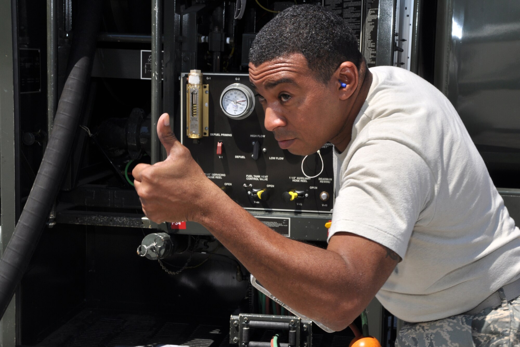 Tech. Sgt. Derrick Latson, liquid fuels operator, 917th Logistics Readiness Squadron, gives a “thumbs up,” indicating the overflow safety valve is working before refueling an A-10 Thunderbolt II at MacDill Air Force Base, Fla., April 1, 2010. More than 100 Airmen from the 917th Wing, Barksdale Air Force Base, La., participated in Patriot Everglades, which supported the training of Joint Terminal Attack Controllers (JTAC) and Combat Search and Rescue (CSAR) operations. (U. S. Air Force Photo/Tech. Sgt. Jeff Walston)

