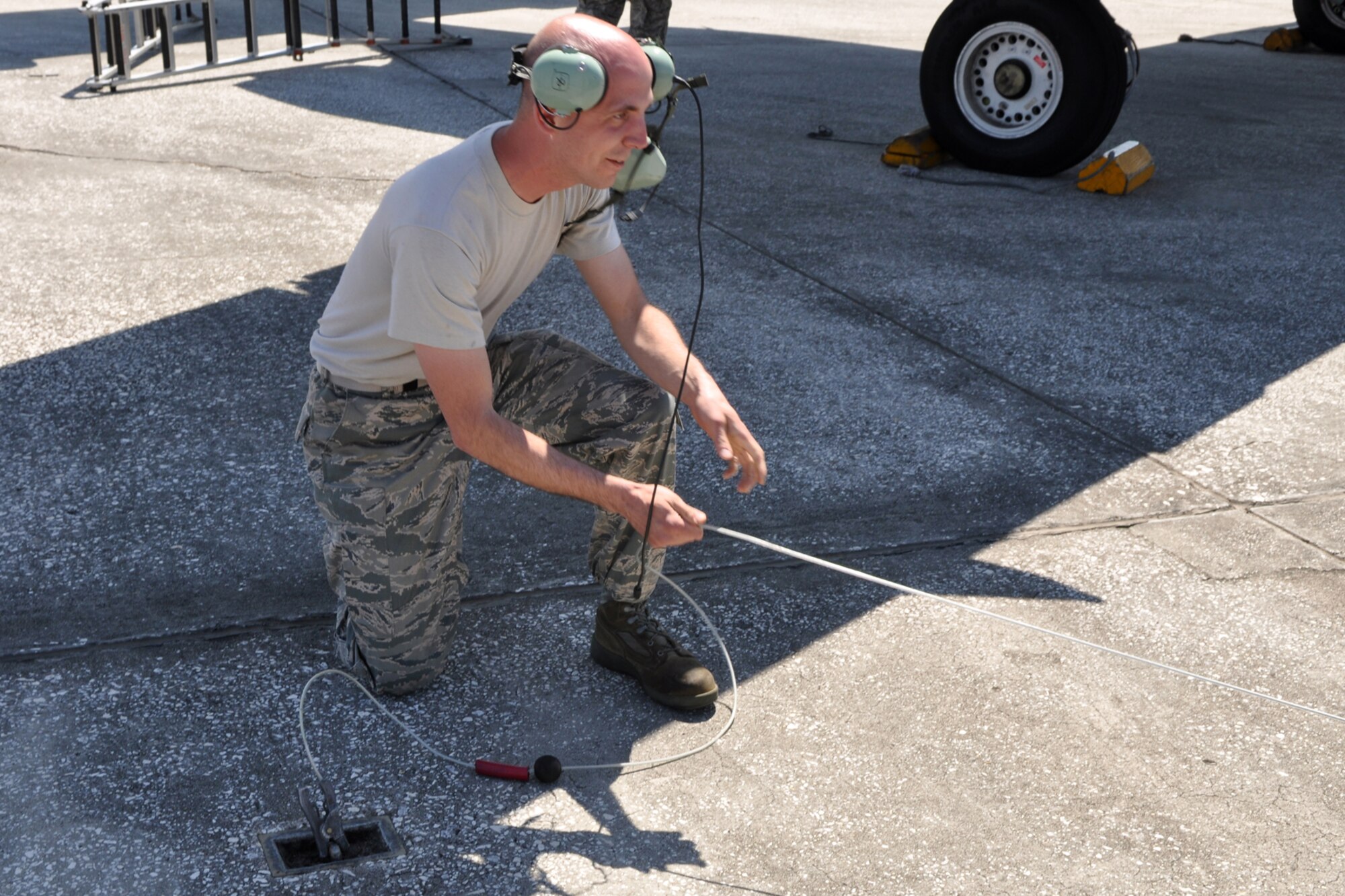 Tech. Sgt. Shannon Wright, propulsion technician, 717th Aircraft Maintenance Squadron, grounds a fuel truck before the refueling hose is connected to an A-10 Thunderbolt II at MacDill Air Force Base, Fla., April 1, 2010. More than 100 Airmen from the 917th Wing, Barksdale Air Force Base, La., participated in Patriot Everglades, which supported the training of Joint Terminal Attack Controllers (JTAC) and Combat Search and Rescue (CSAR) operations. (U. S. Air Force Photo/Tech. Sgt. Jeff Walston)