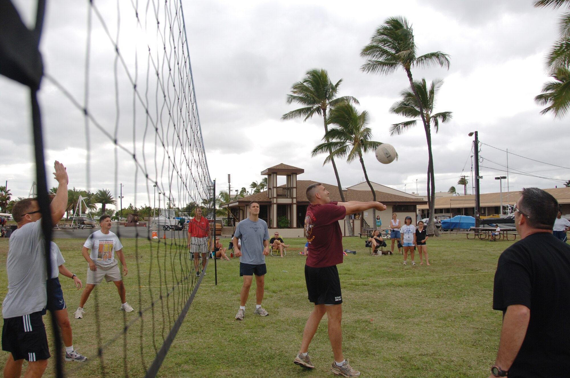 Chief Master Sgt. Ron Gisel, PACAF A6/A6XX, hits the ball in the air during the annual "Chiefs vs. Eagles" volleyball game during Team HIckam Sports Day April 16. The Chiefs defeated the Eagles two games to zero. (U.S. Air Force photo by Senior Airman Nathan Allen)
