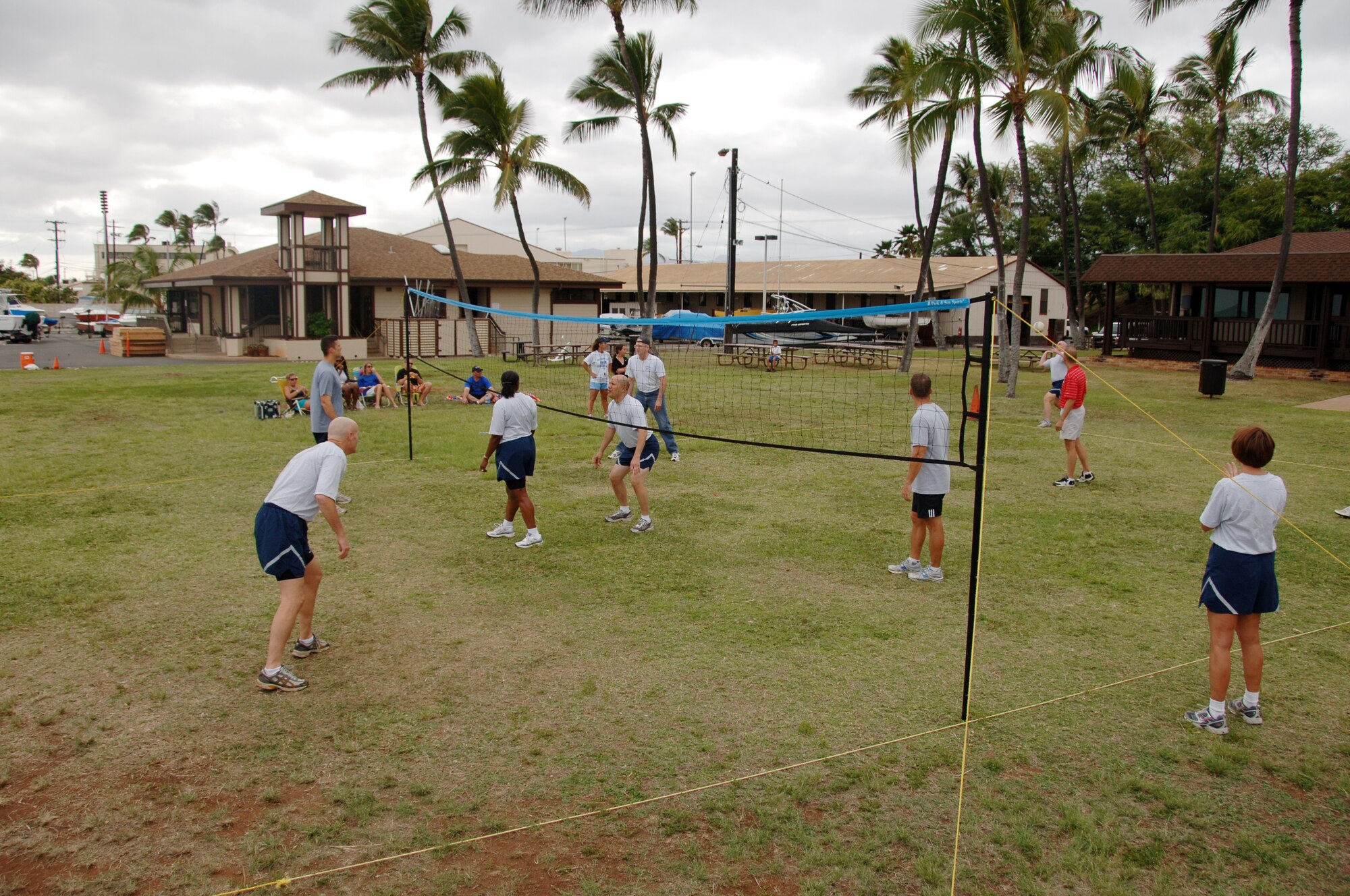 The Chiefs (left) prepare to return a serve from the Eagles during the annual "Chiefs vs. Eagles" volleyball game during Team HIckam Sports Day April 16. The Chiefs defeated the Eagles two games to zero. (U.S. Air Force photo by Senior Airman Nathan Allen)