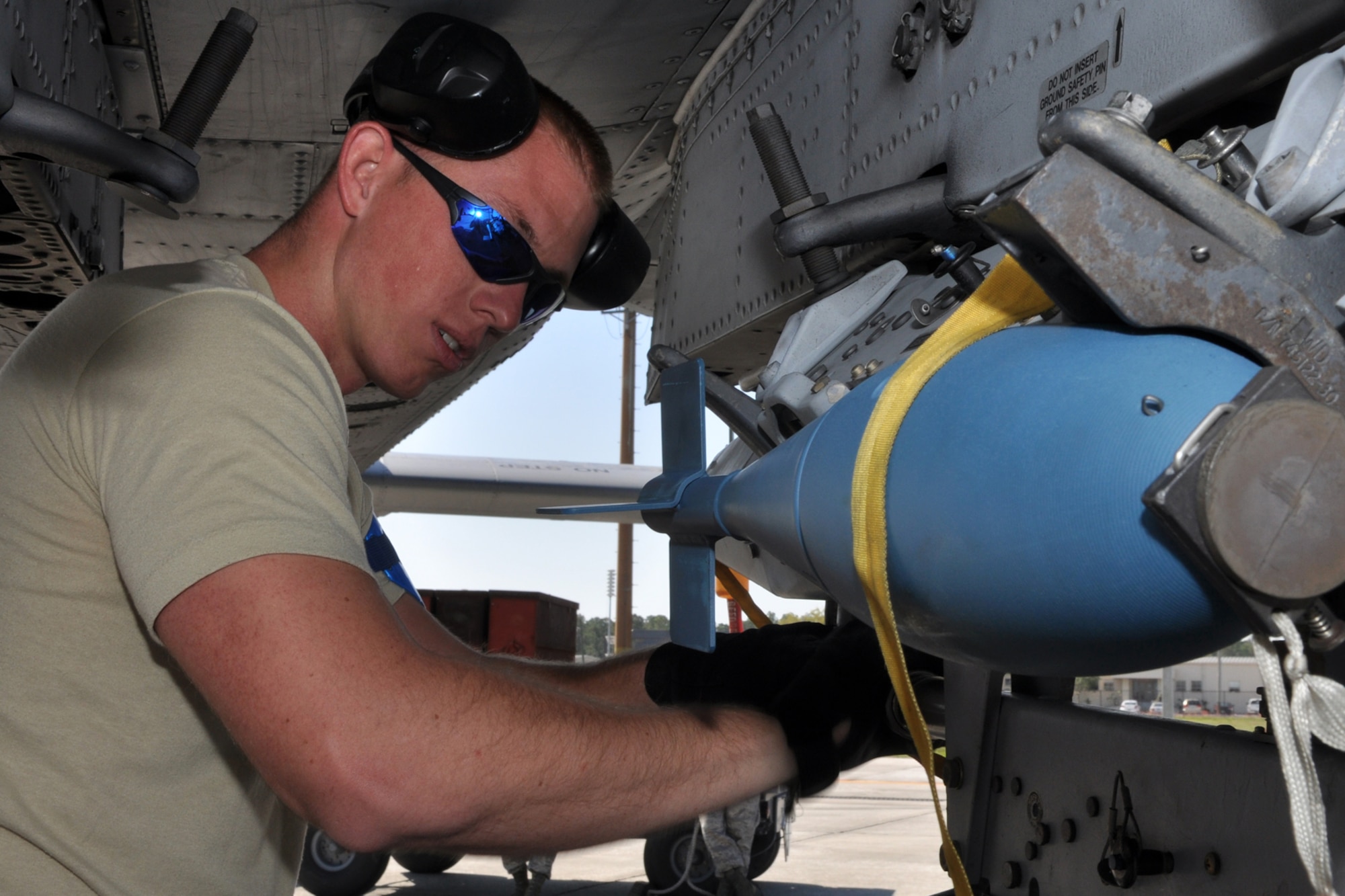 Senior Airman Cody Burt, aircraft armament systems mechanic with the 717th Aircraft Maintenance Squadron, installs cartridge breeches after loading BDU 33 practice bombs on the bomb rack under the wing an A-10 Thunderbolt II at MacDill Air Force Base, Fla., April 1, 2010. The breeches, which resemble shotgun shells, are designed to blow the bombs off the rack when initiated by the pilot. More than 100 Airmen from the 917th Wing, Barksdale Air Force Base, La., participated in Patriot Everglades, which supported the training of Joint Terminal Attack Controllers (JTAC) and Combat Search and Rescue (CSAR) operations. (U. S. Air Force Photo/Tech. Sgt. Jeff Walston)