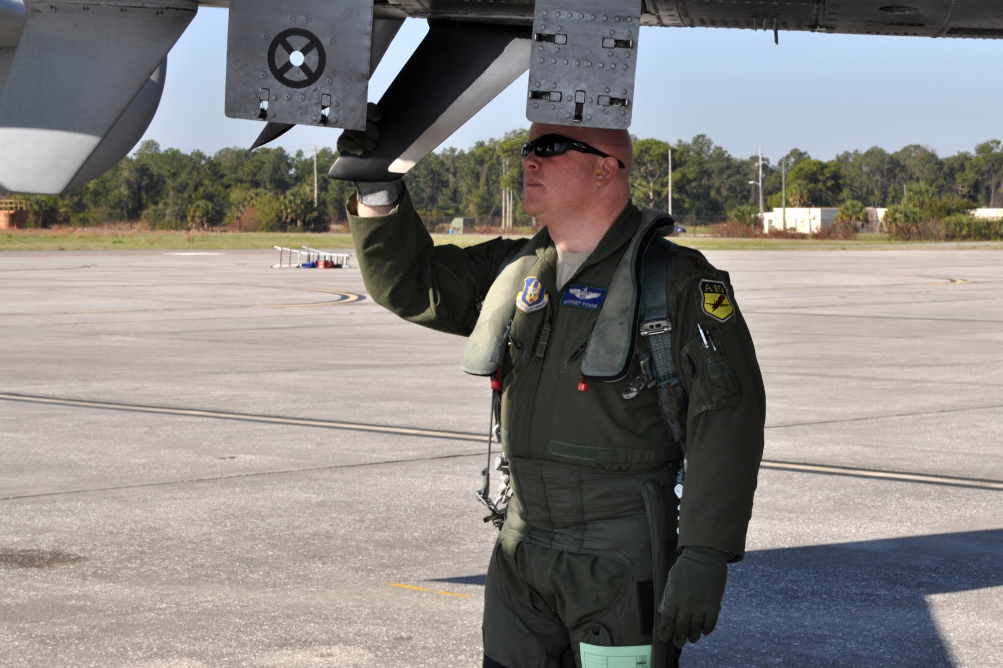 Maj. Garret Povar, an instructor pilot with the 47th Fighter Squadron, does a “walk around” during his pre-flight inmspection of an A-10 Thunderbolt II at MacDill Air Force Base, Fla., April 1, 2010. More than 100 Airmen from the 917th Wing, Barksdale Air Force Base, La., participated in Patriot Everglades, which supported the training of Joint Terminal Attack Controllers (JTAC) and Combat Search and Rescue (CSAR) operations. (U. S. Air Force Photo/Tech. Sgt. Jeff Walston)