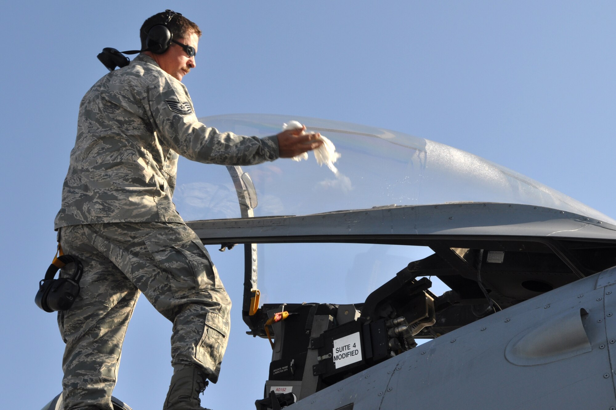 Tech. Sgt. Johnny Egloff, an A-10 aircraft mechanic with the 717th Aircraft Maintenance Squadron, cleans the canopy of an A-10 Thunderbolt II during a pre-flight inspect at MacDill Air Force Base, Fla., April 1, 2010. More than 100 Airmen from the 917th Wing, Barksdale Air Force Base, La., participated in Patriot Everglades, which supported the training of Joint Terminal Attack Controllers (JTAC) and Combat Search and Rescue (CSAR) operations. (U. S. Air Force Photo/Tech. Sgt. Jeff Walston)