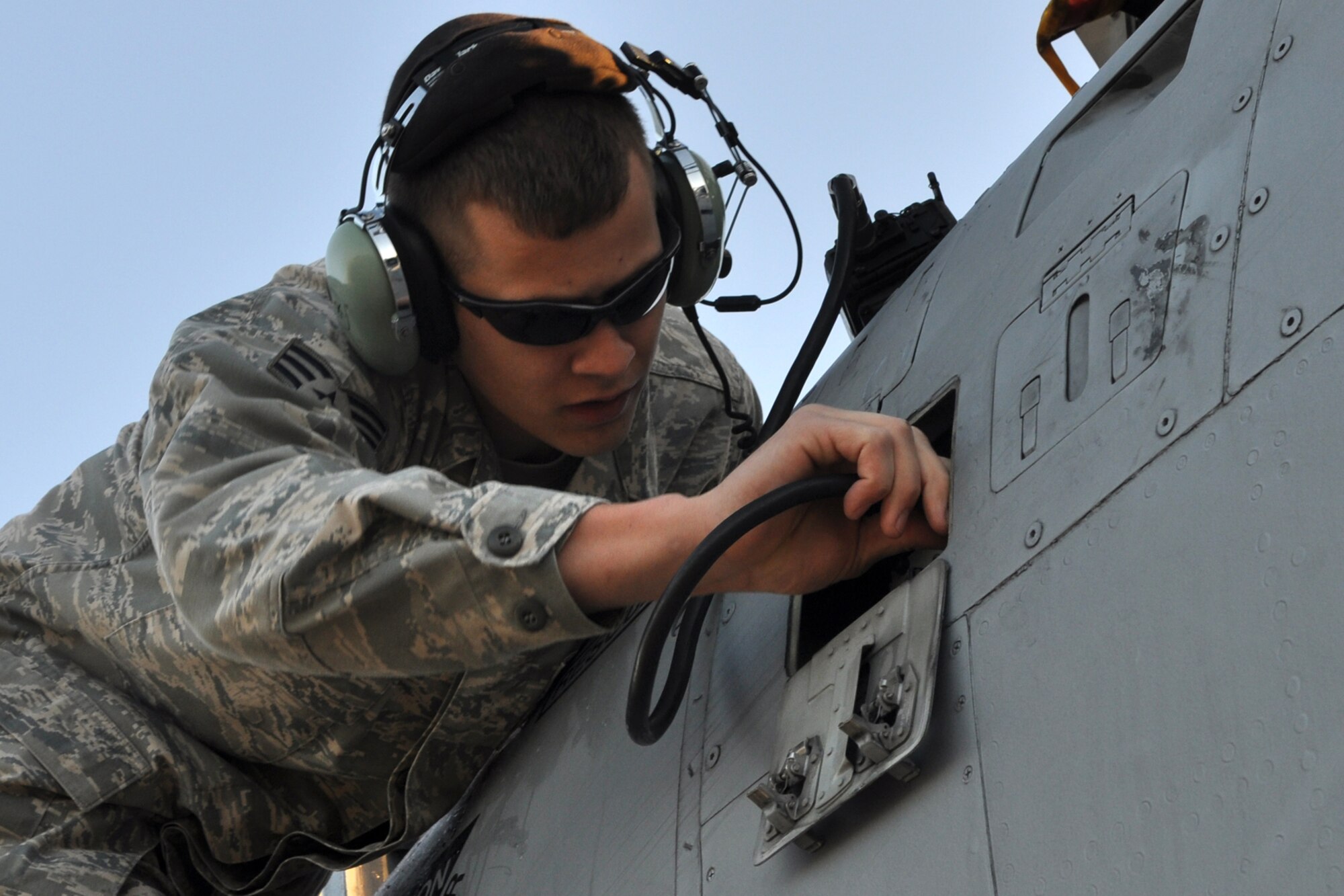 Senior Airman Bryant Jopplin Jr., guidance mechanic for the 917 Aircraft Maintenance Squadron, installs crypto keys into the radio of an A-10 Thunderbolt II at MacDill Air Force Base, Fla., April 1, 2010. More than 100 Airmen from the 917th Wing, Barksdale Air Force Base, La., participated in Patriot Everglades, which supported the training of Joint Terminal Attack Controllers (JTAC) and Combat Search and Rescue (CSAR) operations. (U. S. Air Force Photo/Tech. Sgt. Jeff Walston)