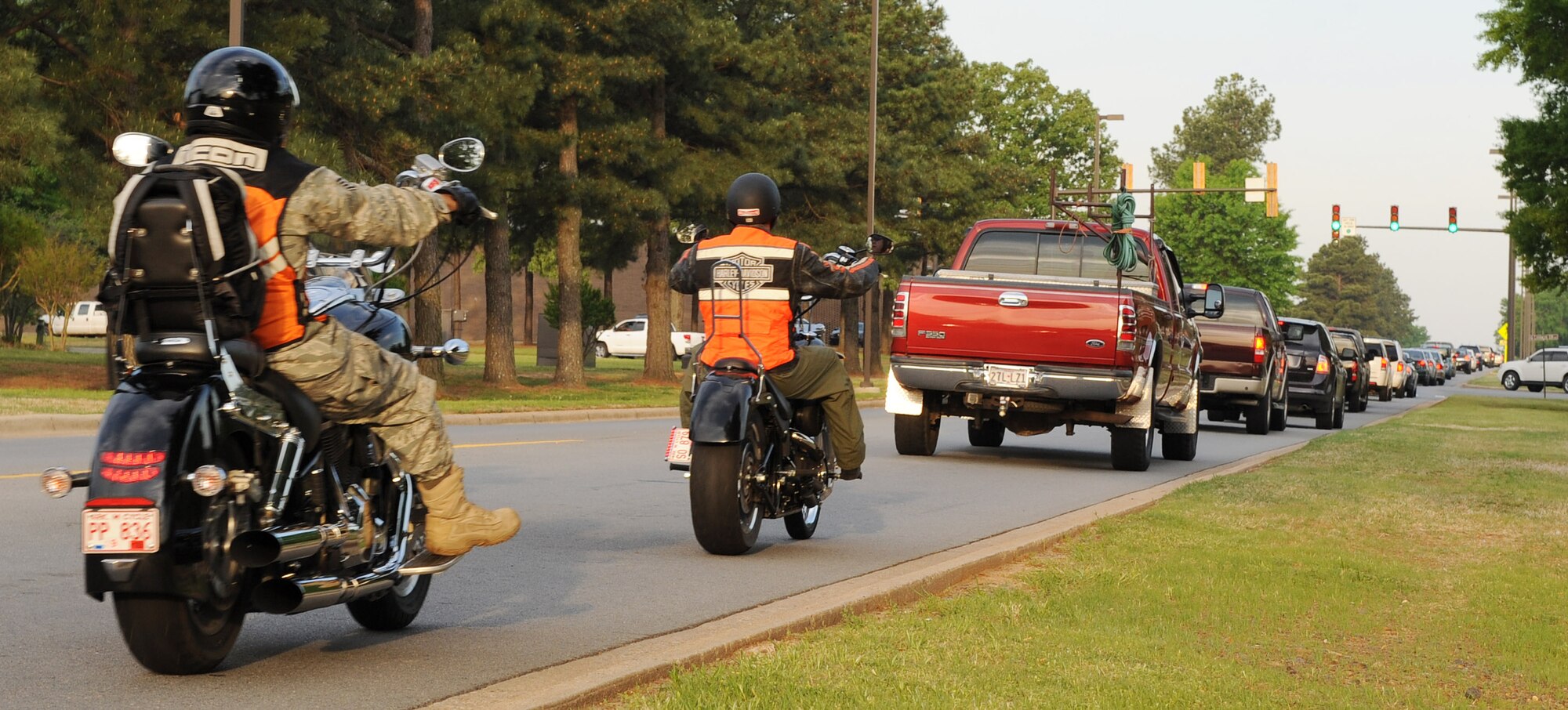 Members of Team Little Rock ride their motorcycles while following a line of cars April 16. The warm spring weather of Arkansas increases the number of motorcyclists traveling on the local roads. All drivers are encouraged to pay closer attention to their surroundings and watch for motorcyclists.  (U.S. Air Force photo by Staff Sgt. Chad Chisholm)