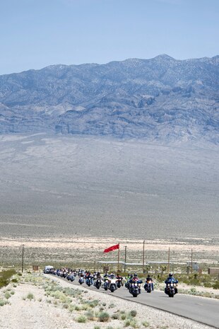 NEVADA TEST AND TRAINING RANGE --  Over 50 Airmen and country music stars rode motorcycles to the 99th Combat Ground Training facility 25 miles northwest of Las Vegas. Nellis Airmen joined the country music stars who participated in the Academy of Country Music's charity USO concert  April 17, 2010 at Nellis Air Force Base. (U.S. Air Force photo by Lawrence Crespo)

