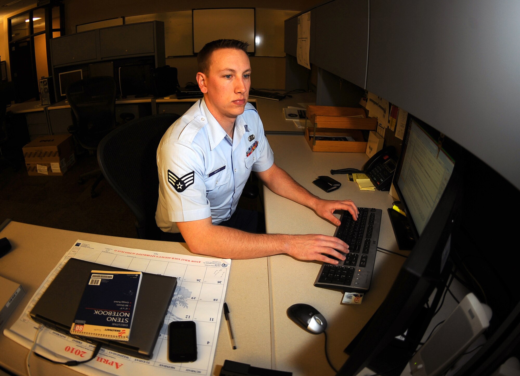 OFFUTT AIR FORCE BASE, Neb. - Senior Airman Dustin Scott, a network infrastructure technician assigned to the Air Force Weather Agency's 2d Systems Operations Squadron here, performs routine observation and maintenance of AFWA's network April 19. Airman Scott was recently announced as the Communications and information Outstanding Communications-Computer Systems award winner. He will accept the award in a formal ceremony in Washington D.C., next month. U.S. Air Force photo by Josh Plueger