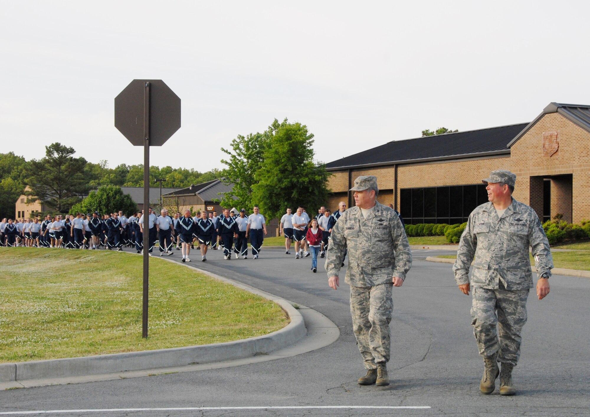 Col. James Summers, 189th Airlift Wing commander, and Chief Master Sgt. Gary Wynn, 189th AW command chief, lead the Suicide Awareness walk April 17 at Little Rock Air Force Base. (U.S. Air Force photo by Staff Sgt. Julian Johnson)