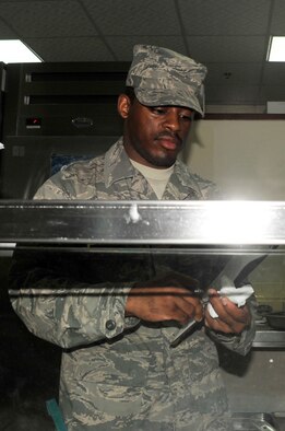 Senior Airman Levar Kinard, services journeyman with the 380th Expeditionary Force Support Squadron, works in Roy's flight kitchen in the operations area for the 380th Air Expeditionary Wing at a non-disclosed base in Southwest Asia on April 15, 2010. the 380th EFSS, as part of the 380th Air Expeditionary Wing, supports operations Iraqi Freedom and Enduring Freedom and the Combined Joint Task Force-Horn of Africa. Airman Kinard is deployed from the 108th Force Support Squadron at Joint Base McGuire-Dix-Lakehurst, N.J., and his hometown is Mount Holly, N.J. (U.S. Air Force Photo/Master Sgt. Scott T. Sturkol/Released)