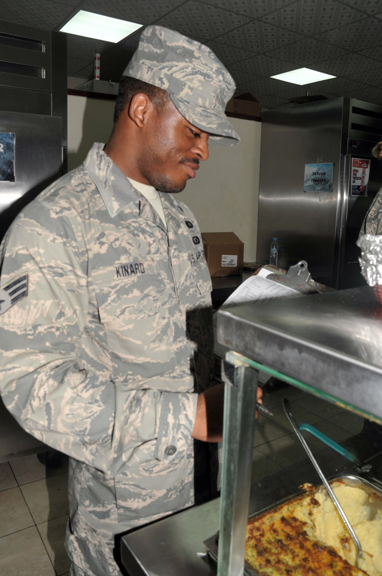 Senior Airman Levar Kinard, services journeyman with the 380th Expeditionary Force Support Squadron, works in Roy's flight kitchen in the operations area for the 380th Air Expeditionary Wing at a non-disclosed base in Southwest Asia on April 15, 2010. the 380th EFSS, as part of the 380th Air Expeditionary Wing, supports operations Iraqi Freedom and Enduring Freedom and the Combined Joint Task Force-Horn of Africa. Airman Kinard is deployed from the 108th Force Support Squadron at Joint Base McGuire-Dix-Lakehurst, N.J., and his hometown is Mount Holly, N.J. (U.S. Air Force Photo/Master Sgt. Scott T. Sturkol/Released)