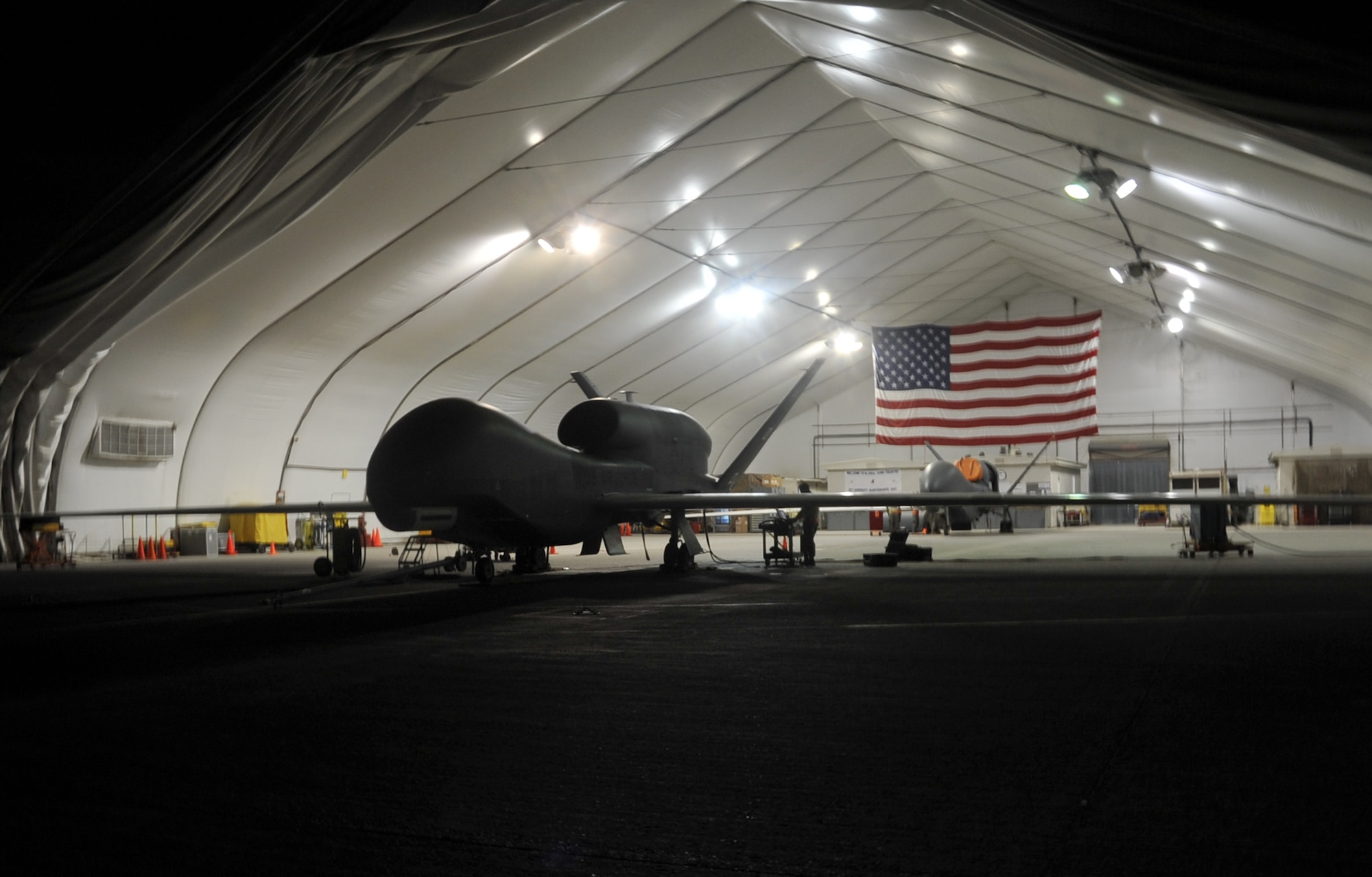 A maintenance technician from the 380th Expeditionary Aircraft Maintenance Squadron's Global Hawk aircraft maintenance unit works on a Global Hawk during operations on the flightline April 15, 2010, at a non-disclosed base in Southwest Asia. The RQ-4 is assigned to the 99th Expeditionary Reconnaissance Squadron and deployed from Beale Air Force Base, Calif. The RQ-4 Global Hawk is a high-altitude, long-endurance unmanned aircraft system with an integrated sensor suite that provides intelligence, surveillance and reconnaissance, or ISR, capability worldwide. Global Hawk's mission is to provide a broad spectrum of ISR collection capability to support joint combatant forces in worldwide peacetime, contingency and wartime operations. The 380th EAMXS and 99th ERS, as part of the 380th Air Expeditionary Wing, supports operations Iraqi Freedom and Enduring Freedom and the Combined Joint Task Force-Horn of Africa. (U.S. Air Force Photo/Master Sgt. Scott T. Sturkol/Released)